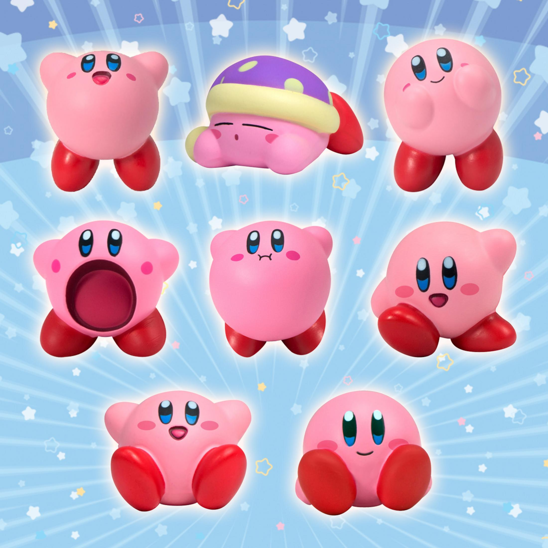 Sept Kirby roses aux pieds rouges sur fond bleu avec des étoiles.