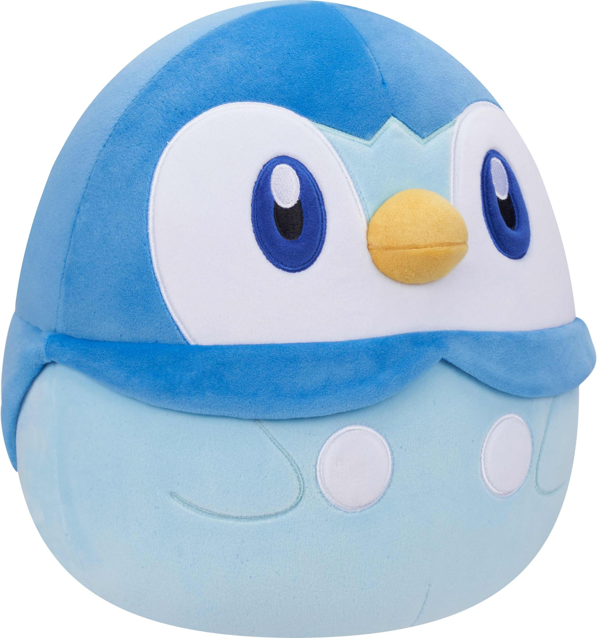 Ein blauer Plüschpinguin mit gelbem Schnabel und weißen Kreisen auf dem Bauch.