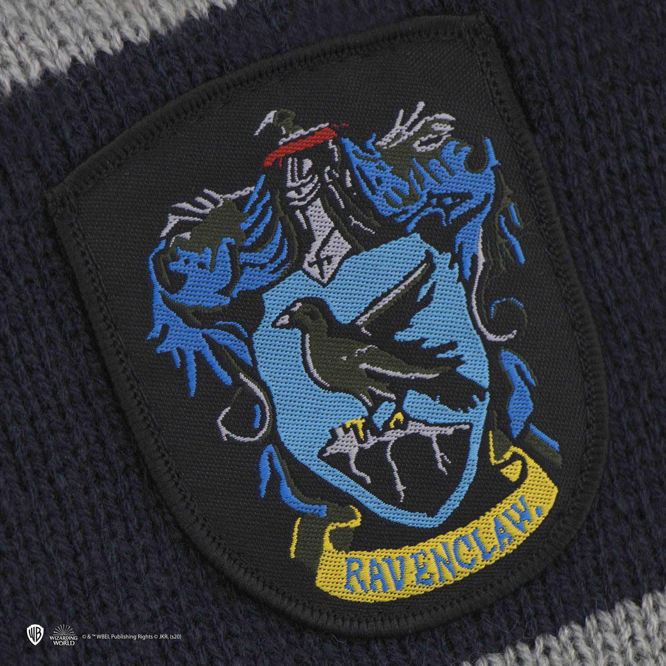 Ravenclaw-Wappen auf gestricktem Stoff in Grau und Dunkelblau.