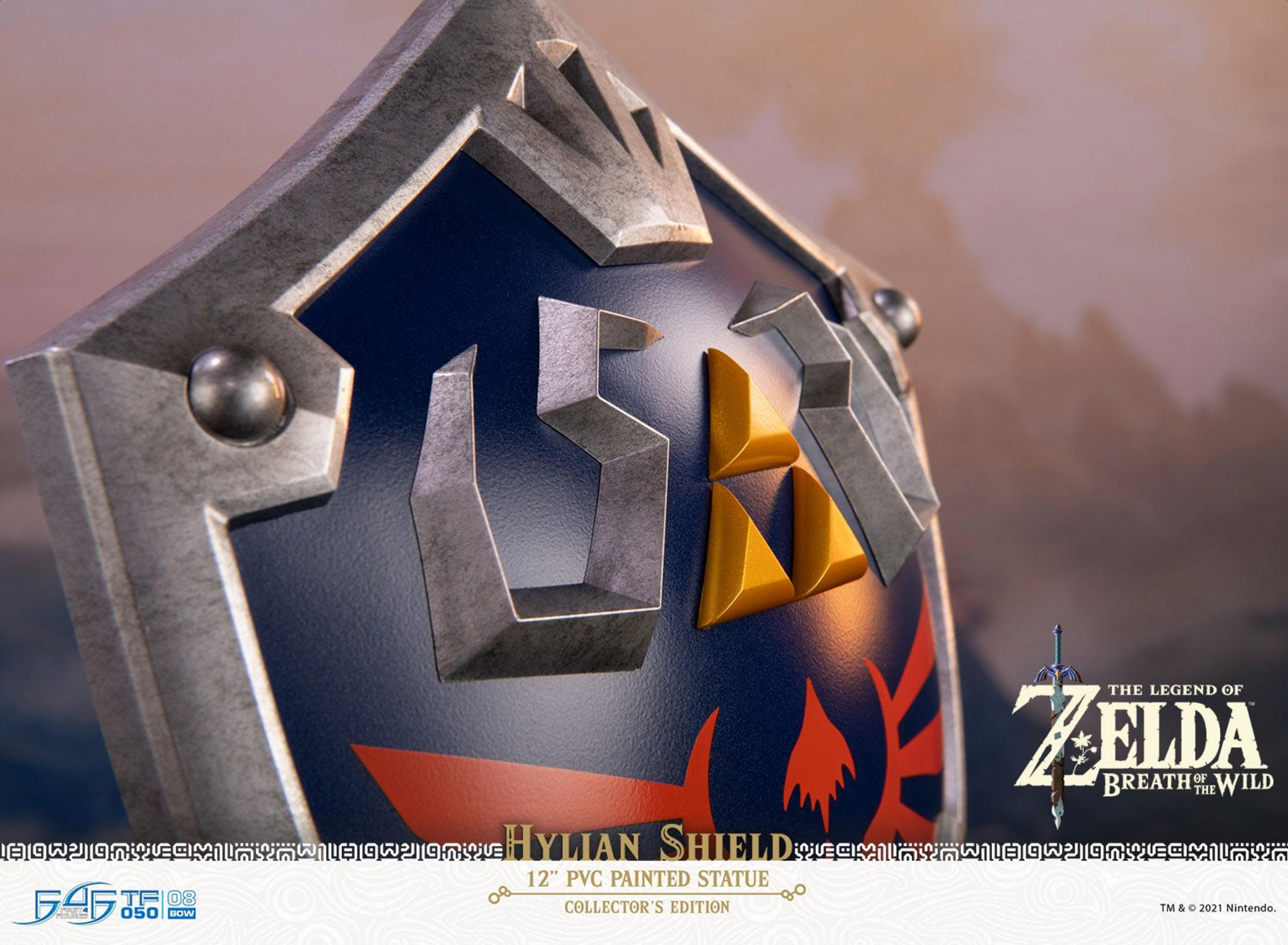 Ein detailliertes Hylian-Schild-Statuenmodell mit dem Zelda-Logo.