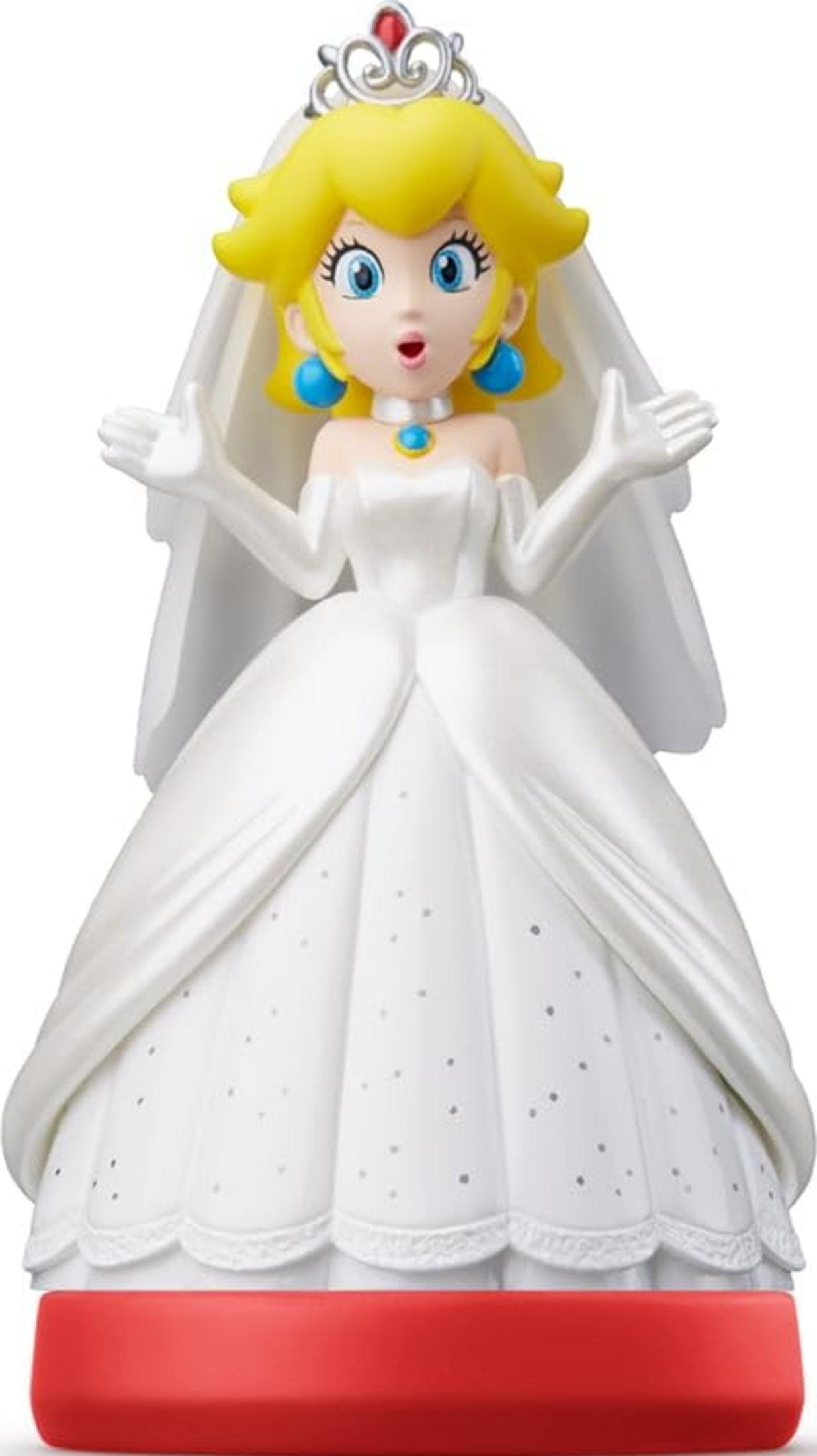Prinzessin Peach in einem weißen Brautkleid mit Diadem und Schleier auf rotem Sockel.