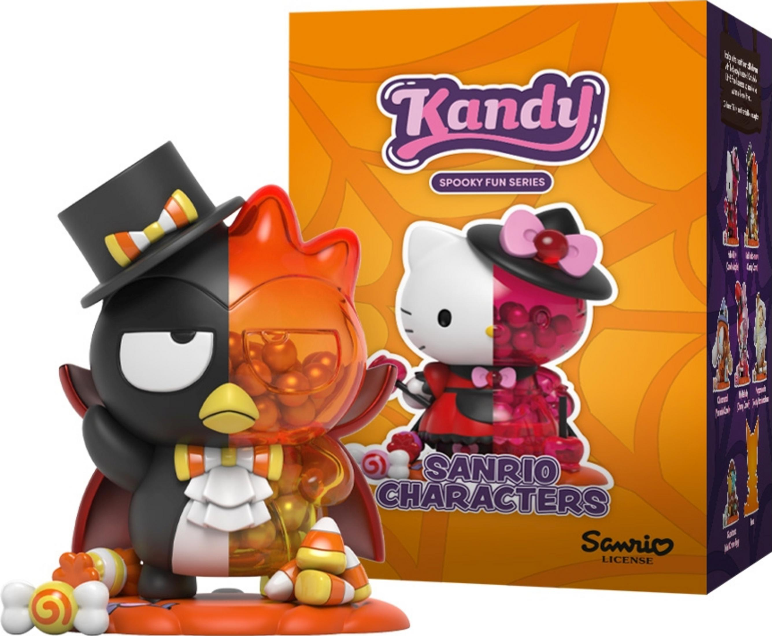 Une figurine d'oiseau moitié noir, moitié orange avec un haut-de-forme et des bonbons.