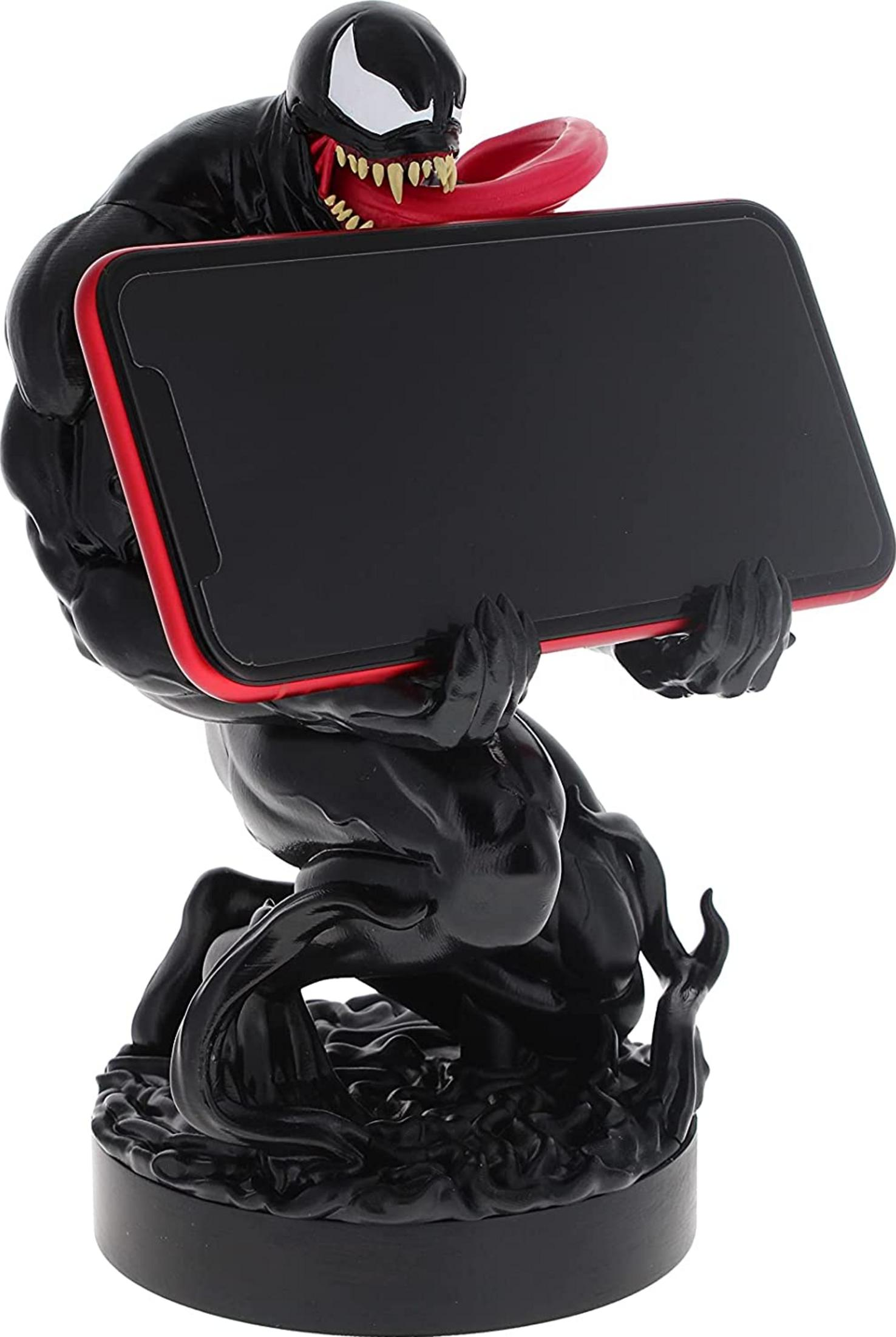 Figura nera di Venom tiene uno smartphone con bordo rosso. Occhi bianchi, denti aguzzi.
