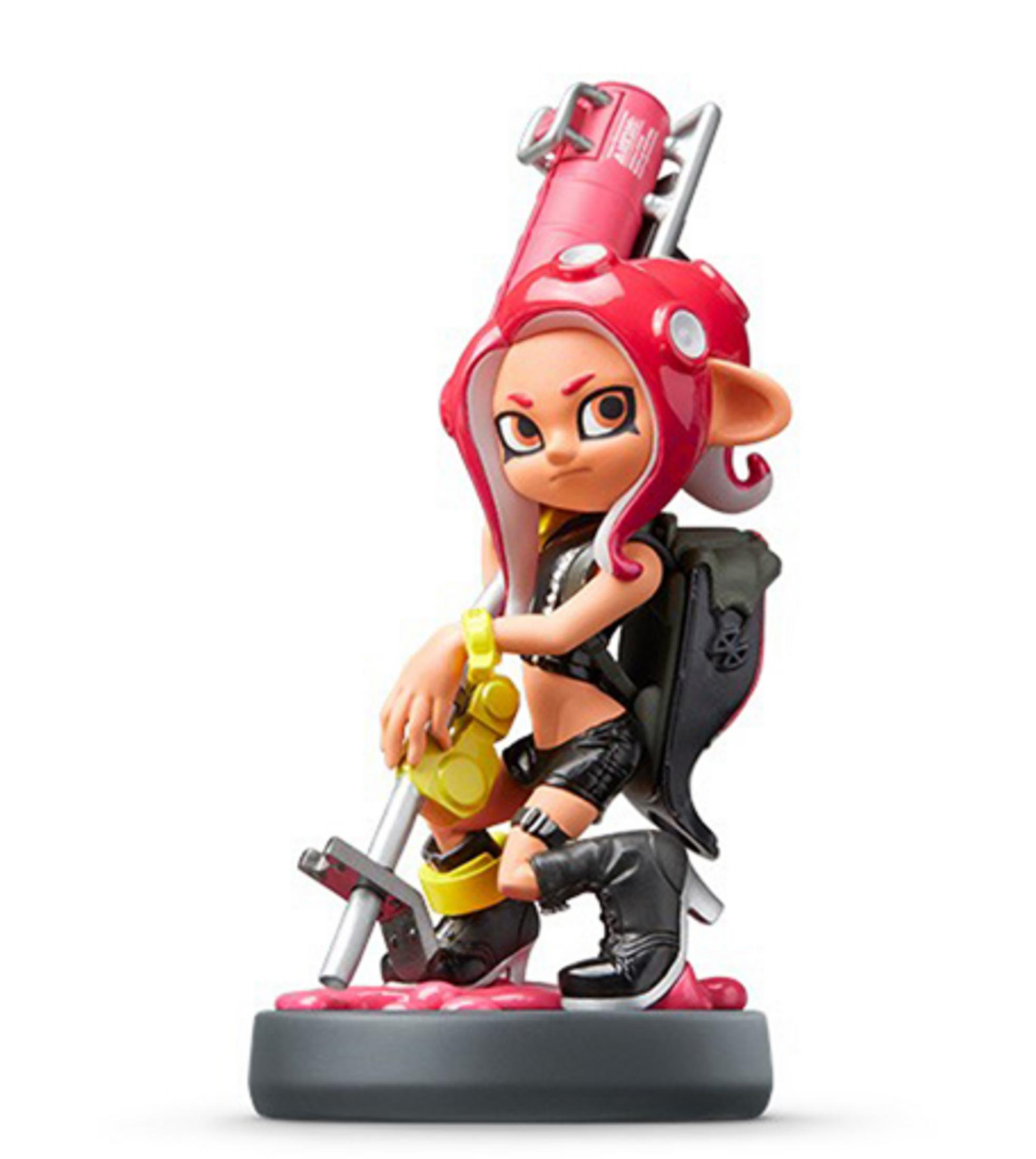 Une figurine agenouillée aux cheveux rouges et un accessoire d'arme rose.