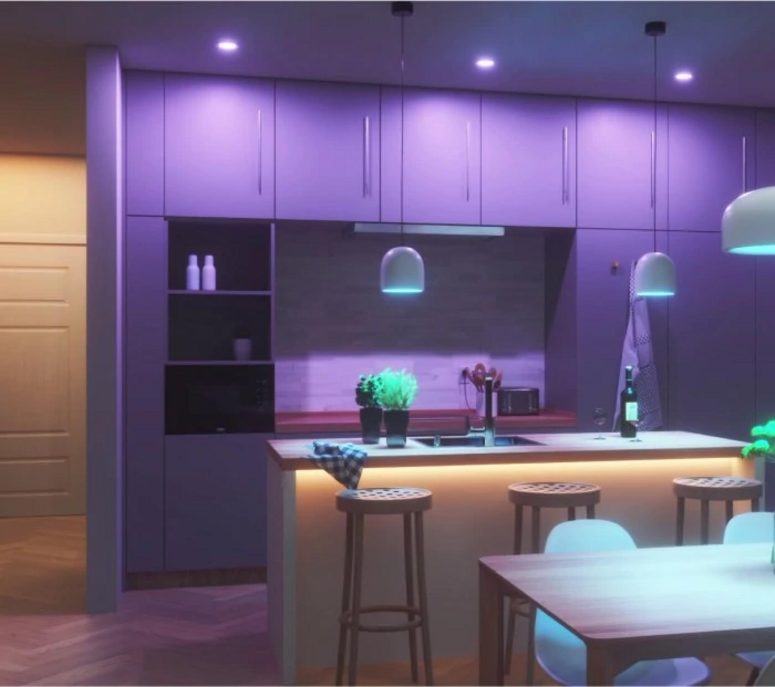 Cucina moderna con illuminazione viola, sgabelli, tavolo e vino.