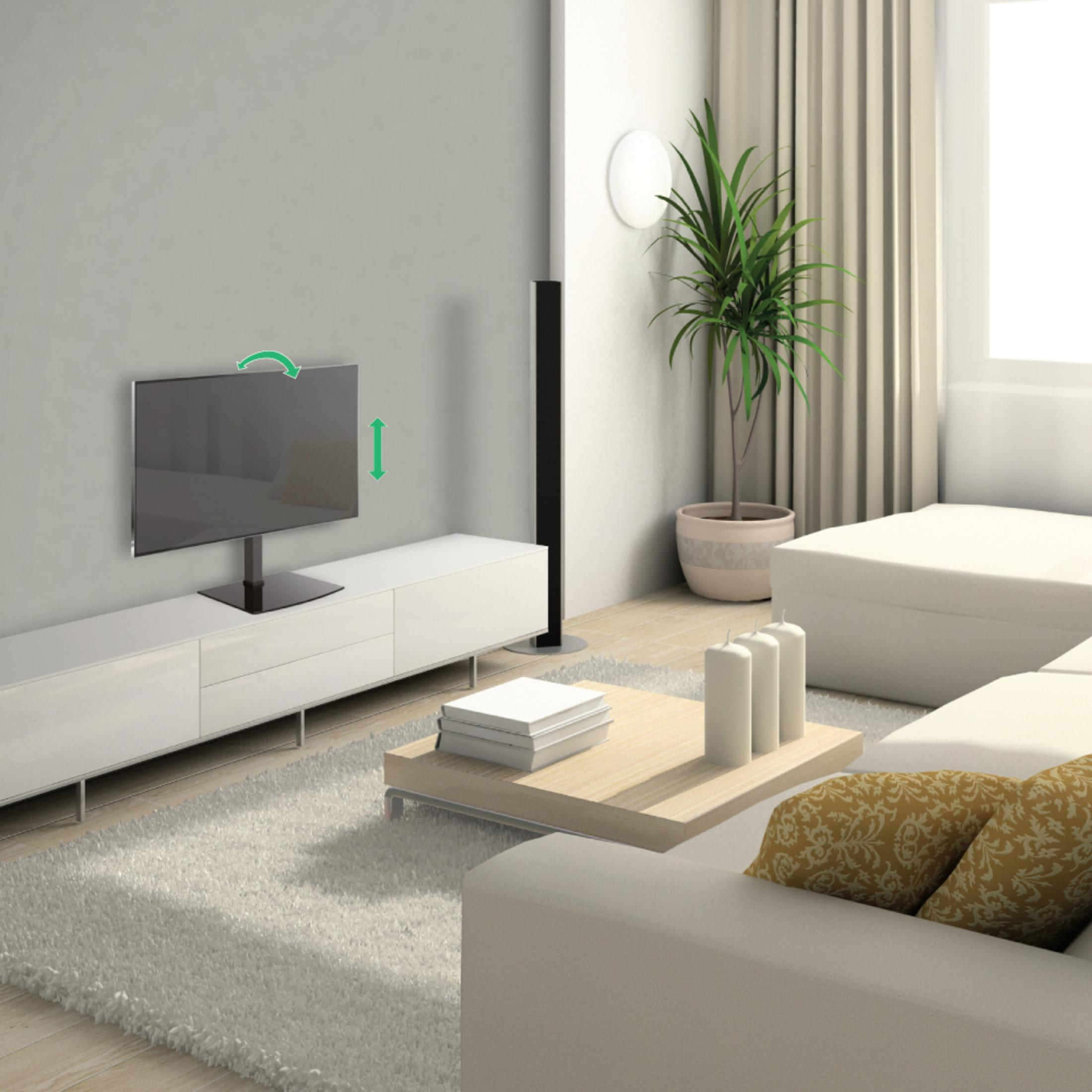 Modern living room with TV, sofa, coffee table, and plant.