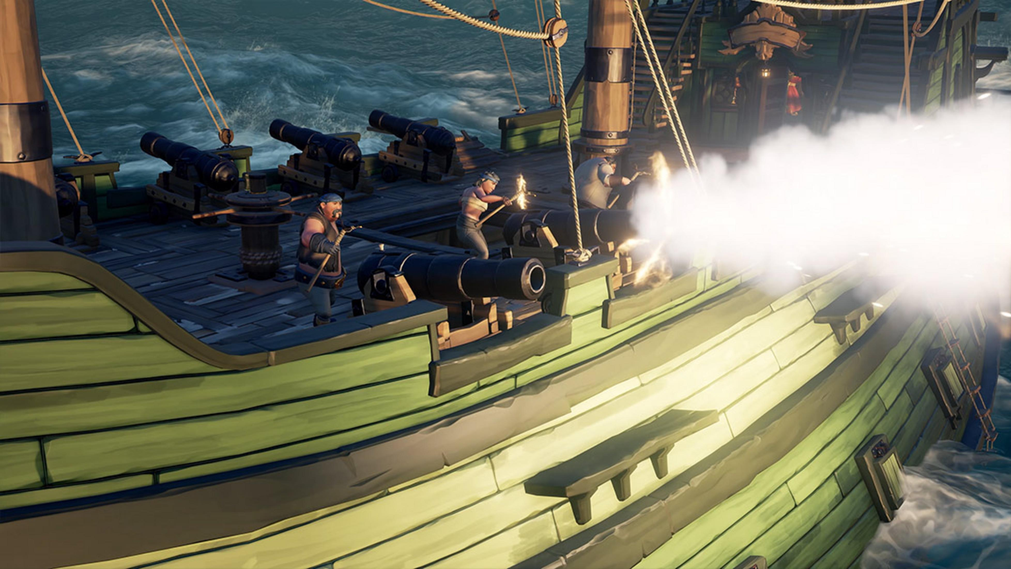 Pirati sparano cannonate su una nave verde che naviga nell'oceano.