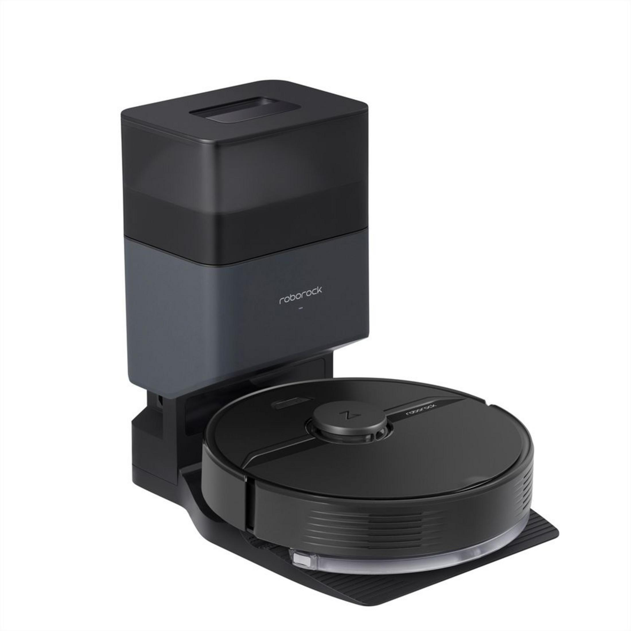 Czarny robot odkurzający stoi na stacji ładującej z czarnym pojemnikiem na kurz.