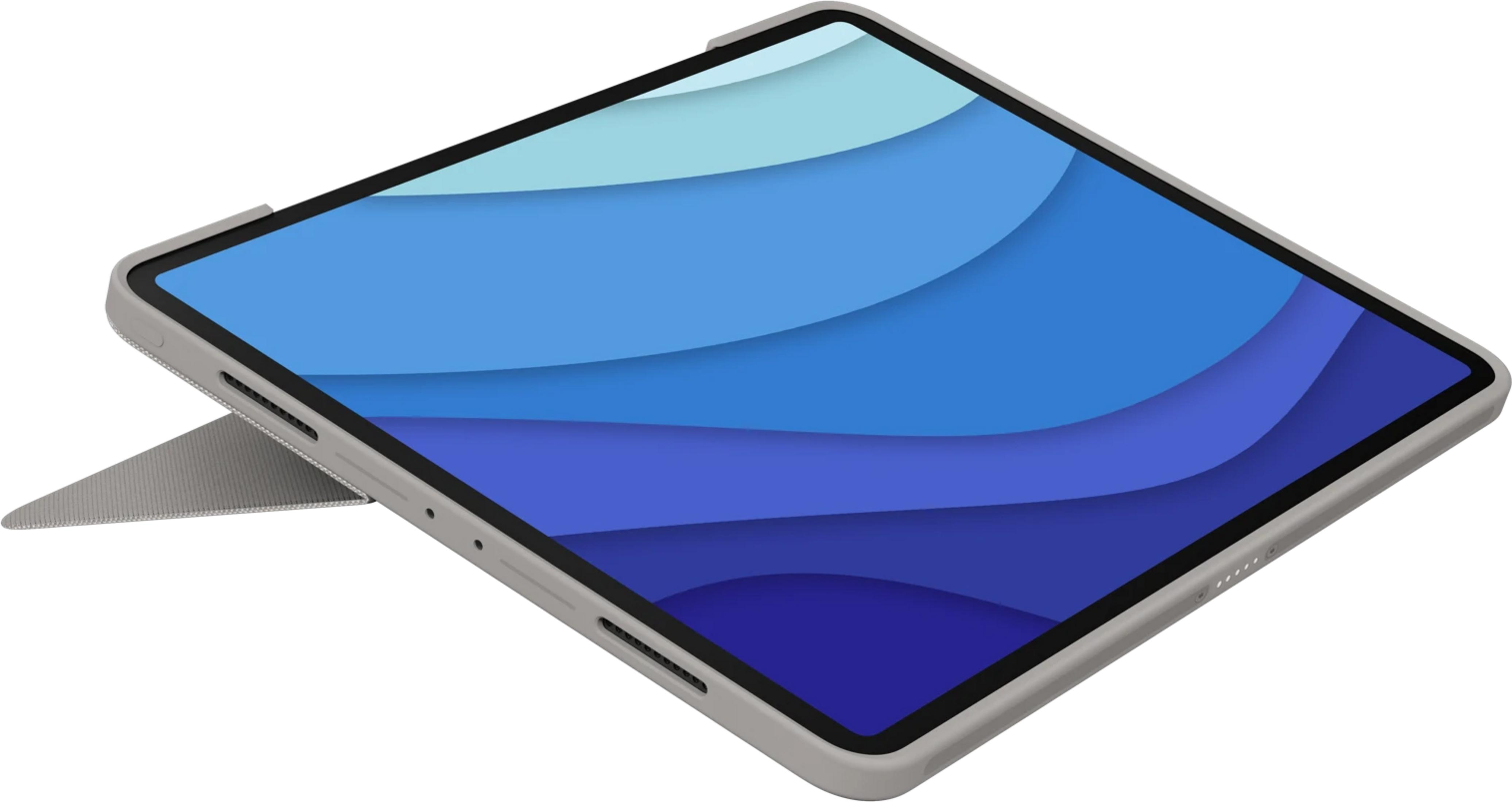 Tablet grigio con sfondo blu ondulato e supporto.