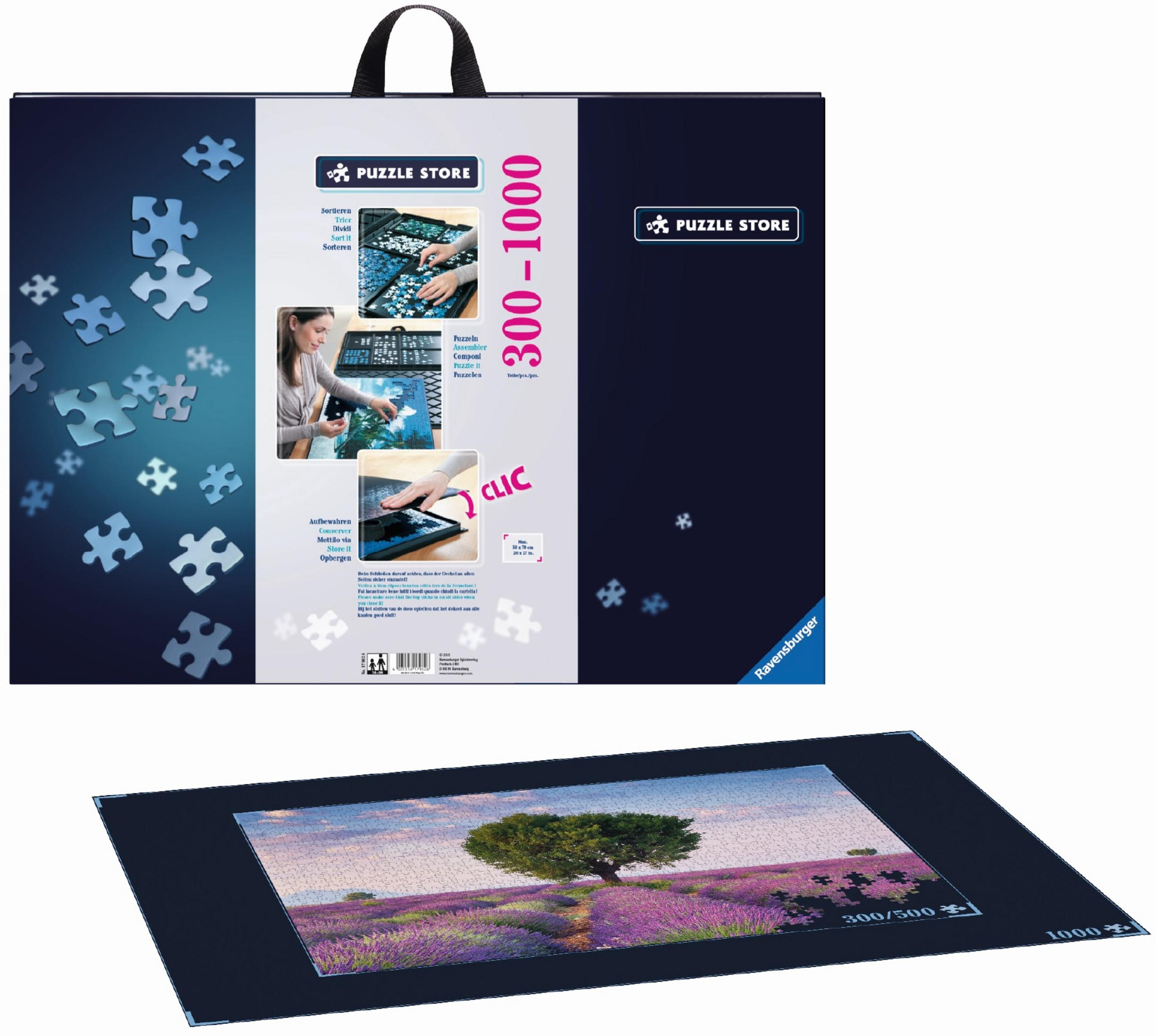 Puzzle-Verpackung und ausgelegte 1000-Teile-Puzzle eines Lavendelfeldes mit Baum.