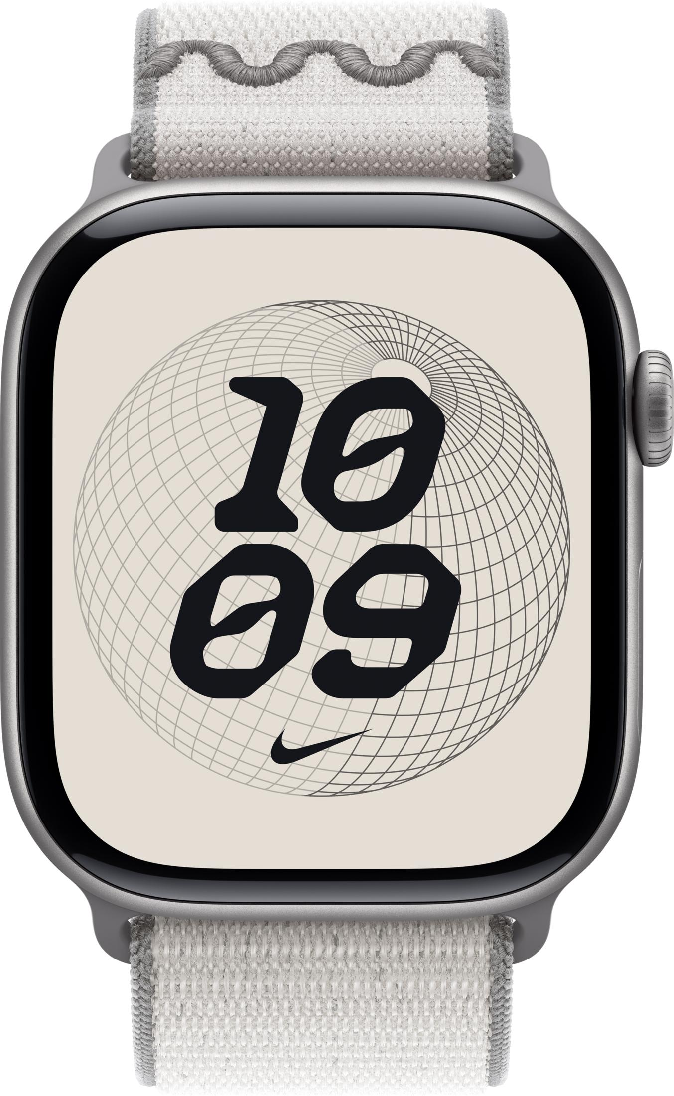 Szary smartwatch z białym paskiem, pokazuje 10:09 na beżowej tarczy.