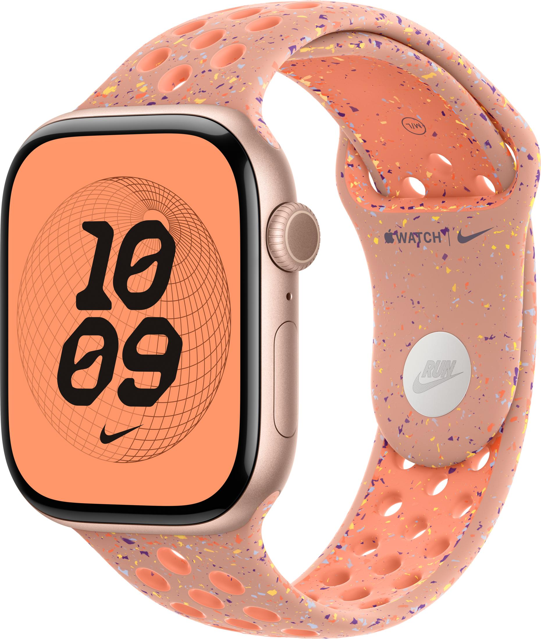 Un Apple Watch rosa con cinturino a pois e quadrante arancione.