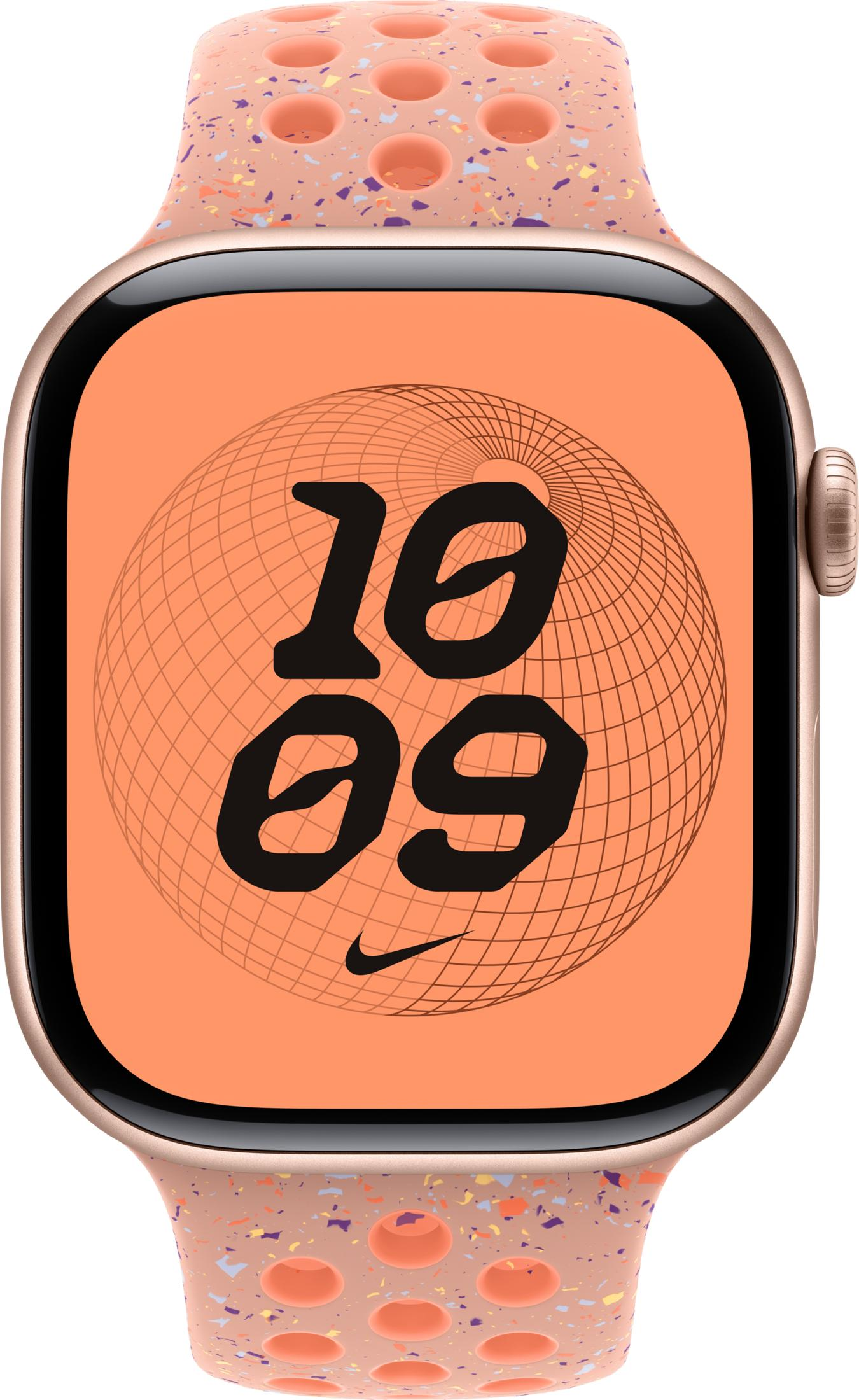 Uno smartwatch color pesca con quadrante arancione e cinturino maculato traforato.