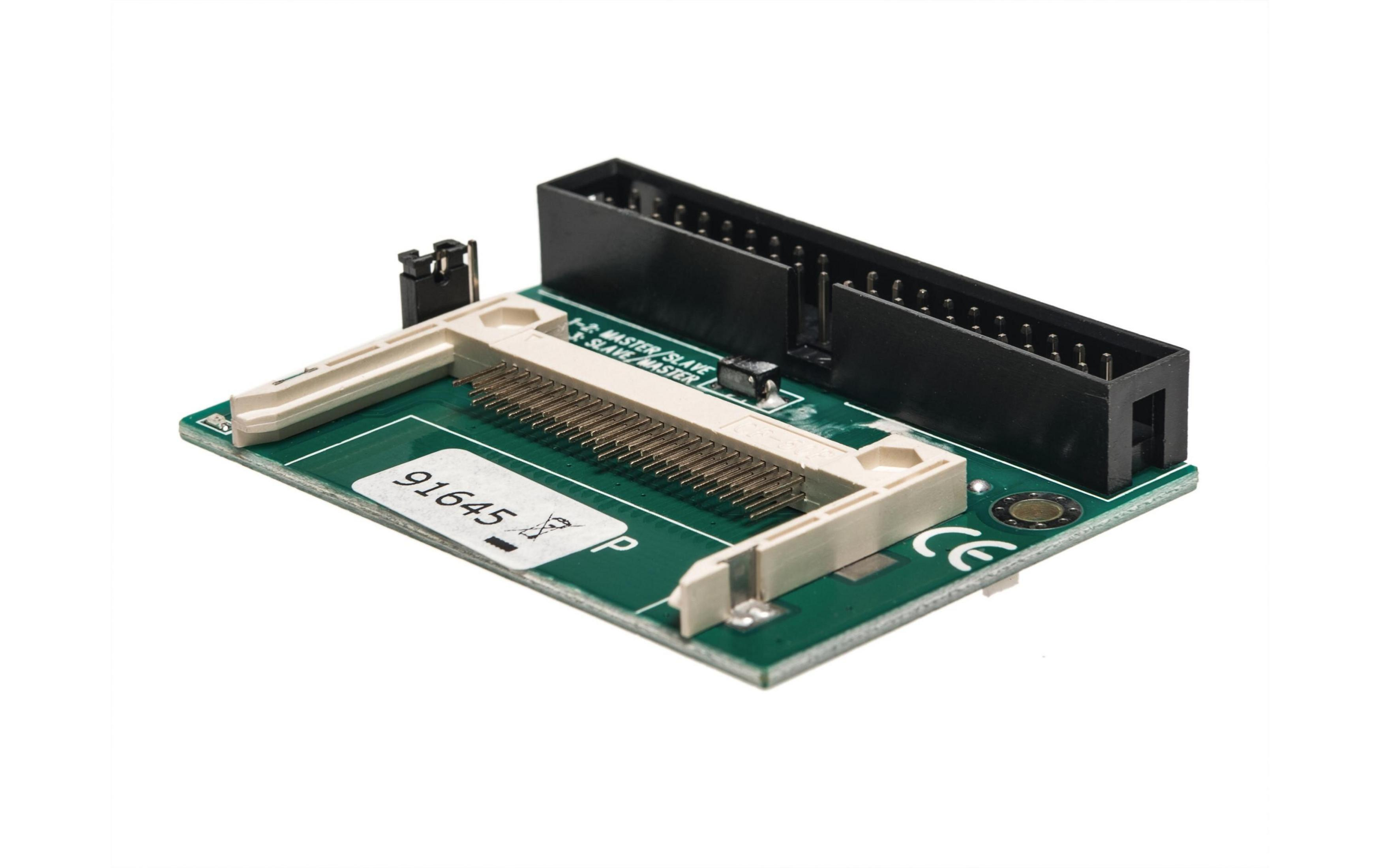 Un PCB verde con connettori, etichette MASTER/SLAVE e marchio CE.