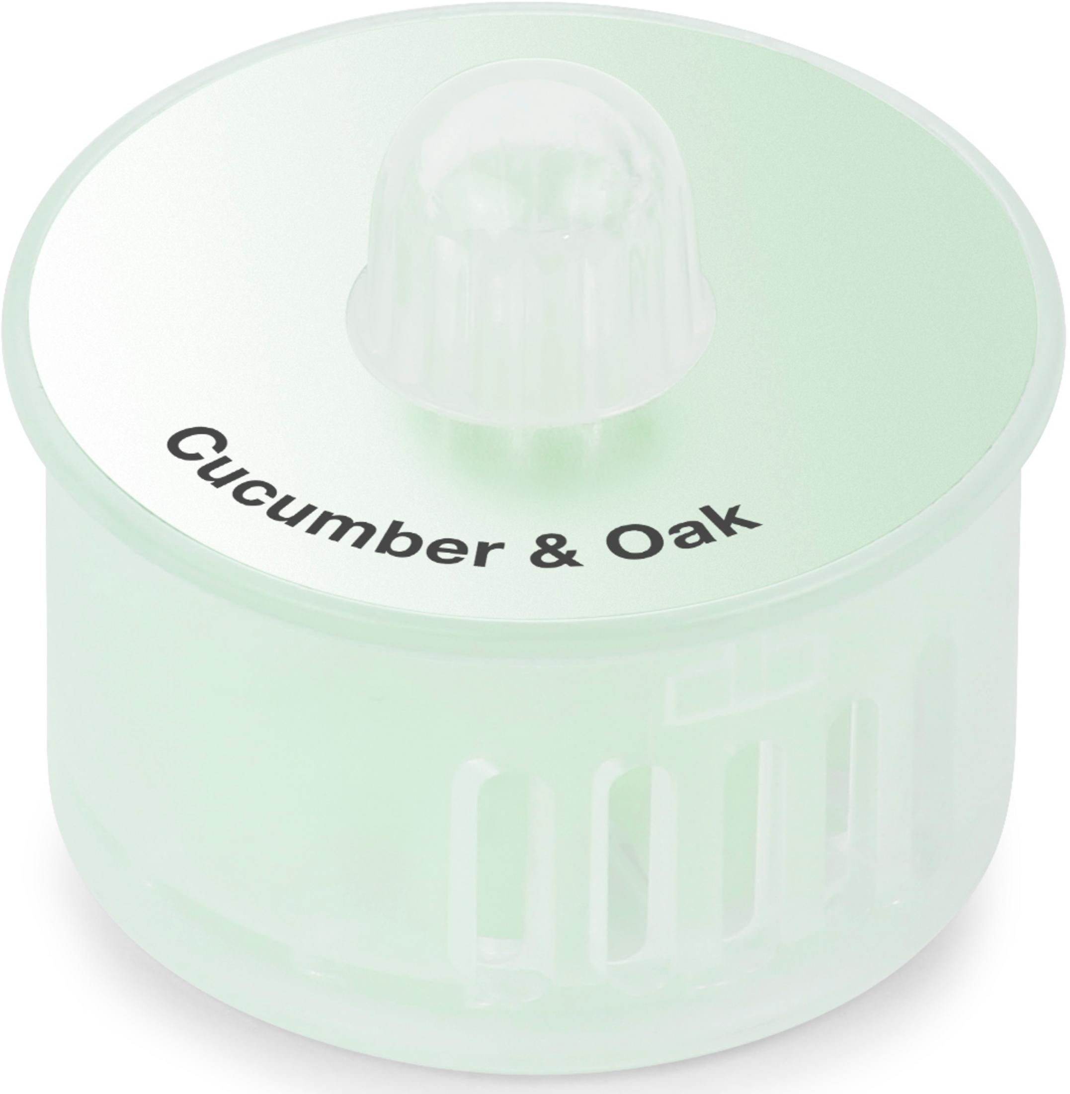 Világoszöld tartály átlátszó fedéllel, 'Cucumber & Oak' felirattal.