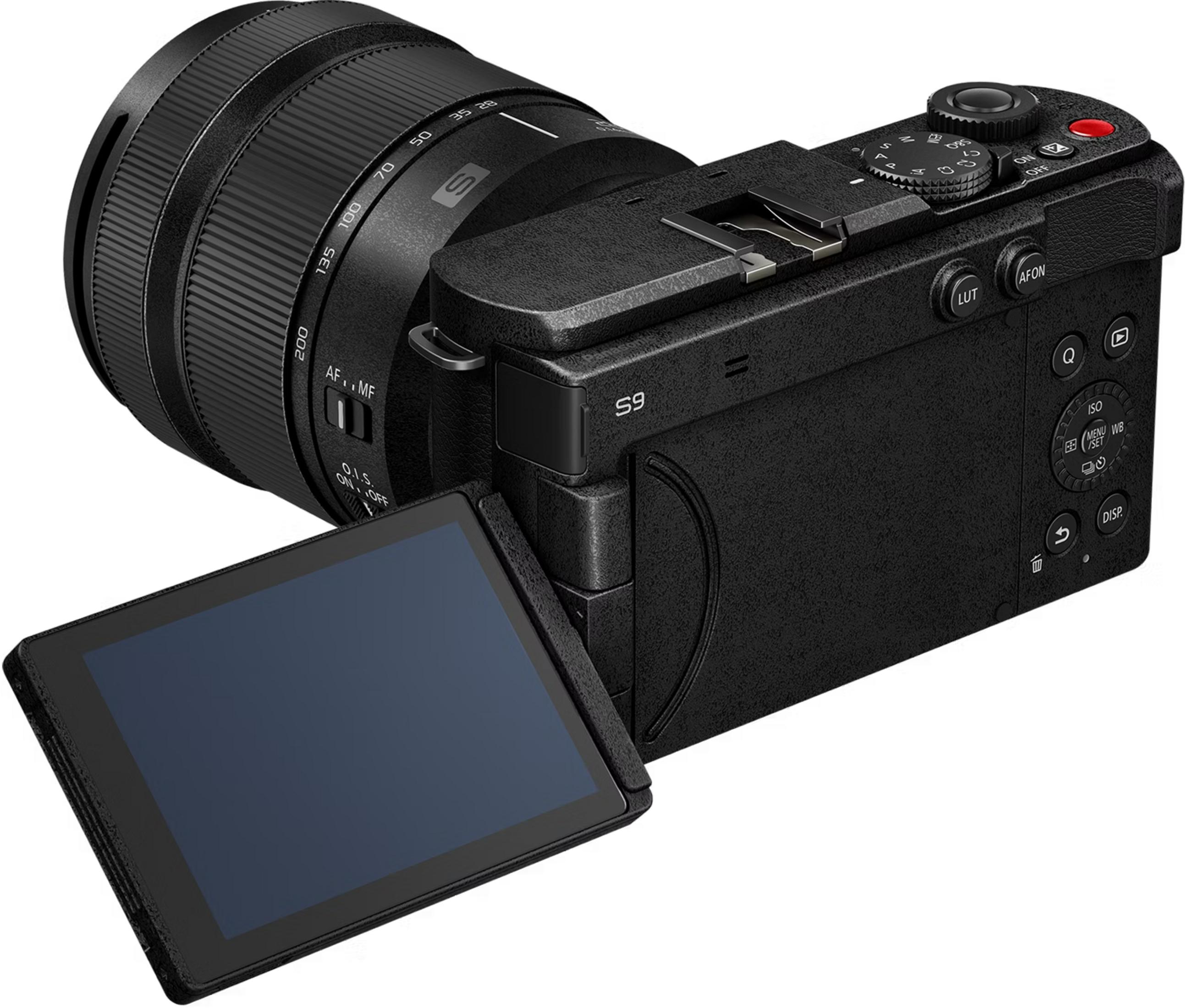 A black camera with a zoom lens and a flipped-out screen.