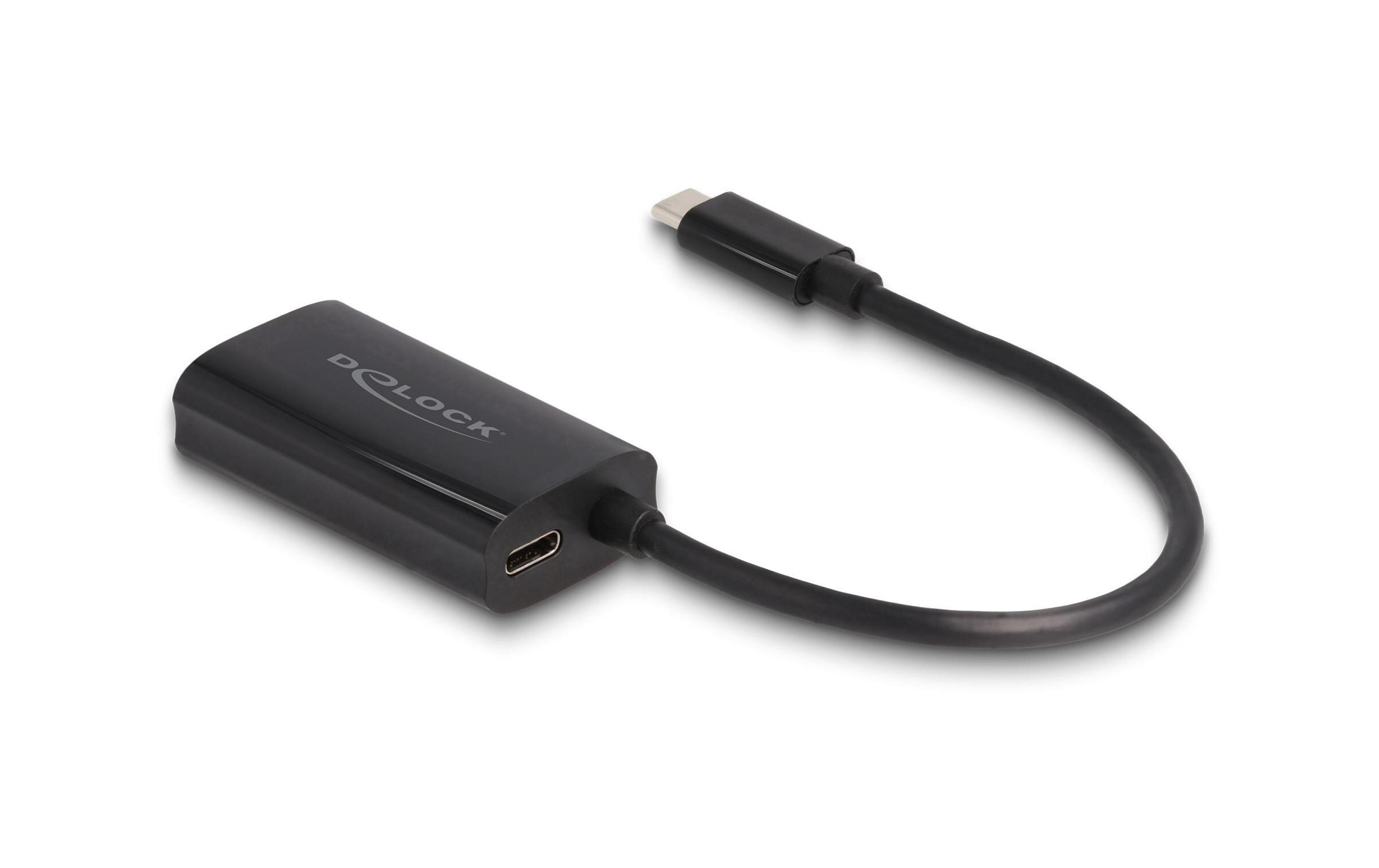Un adaptador USB-C negro con cable sobre fondo blanco.