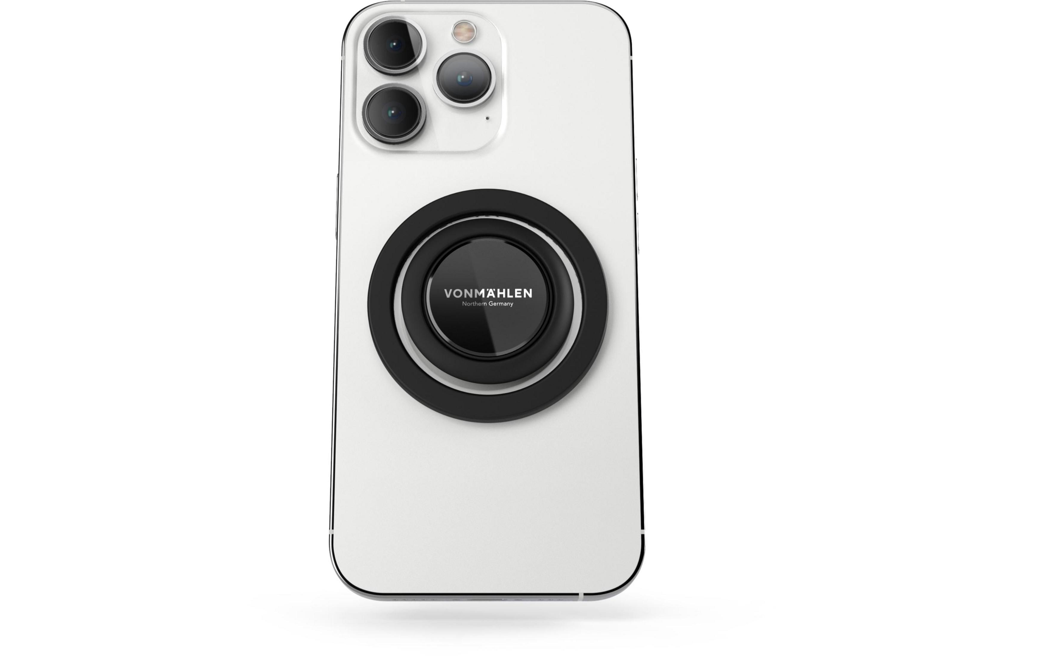 Ein weißes Smartphone mit einem schwarzen Ringhalter auf der Rückseite.
