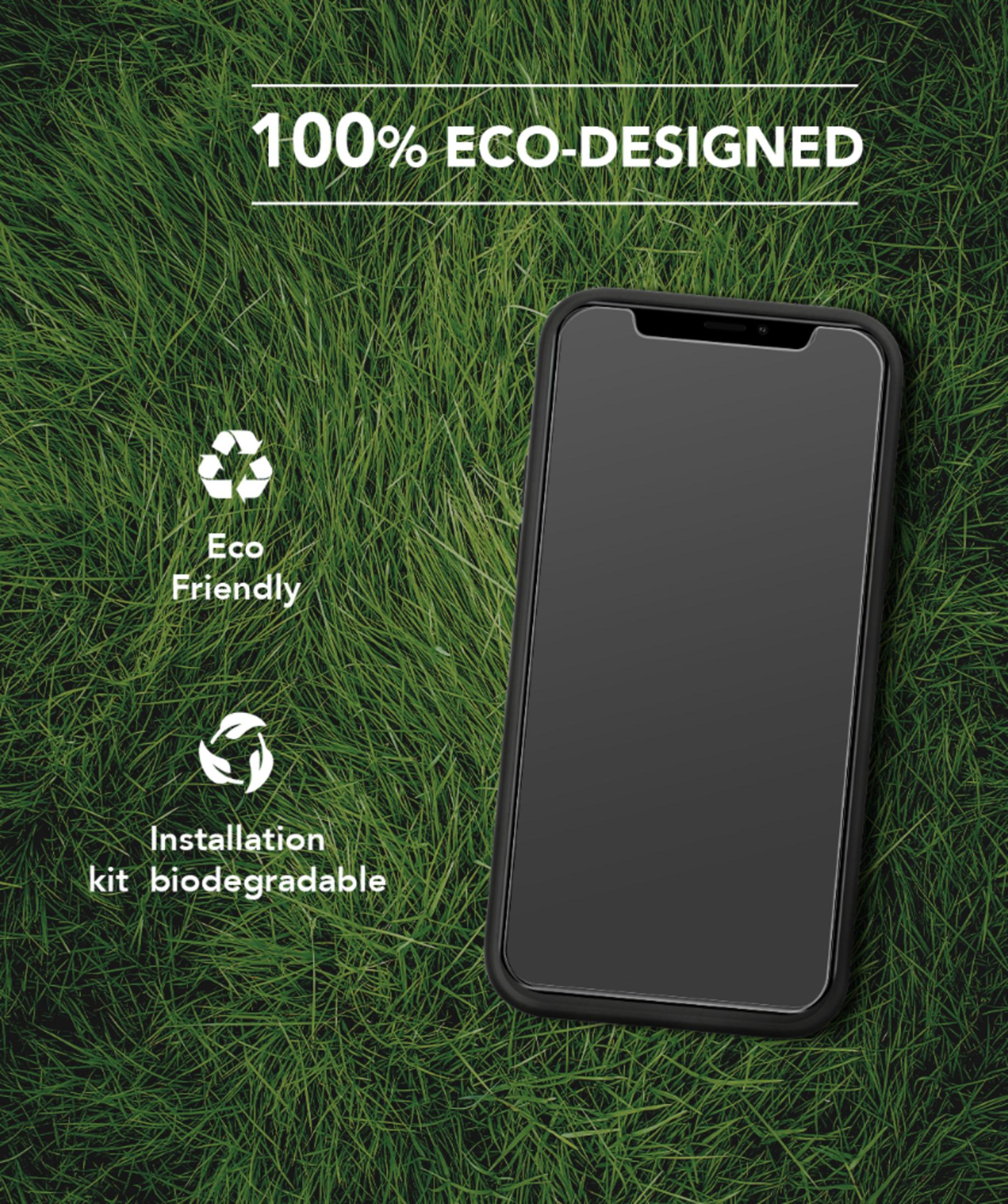 A smartphone lies on grass. 100% eco-designed.