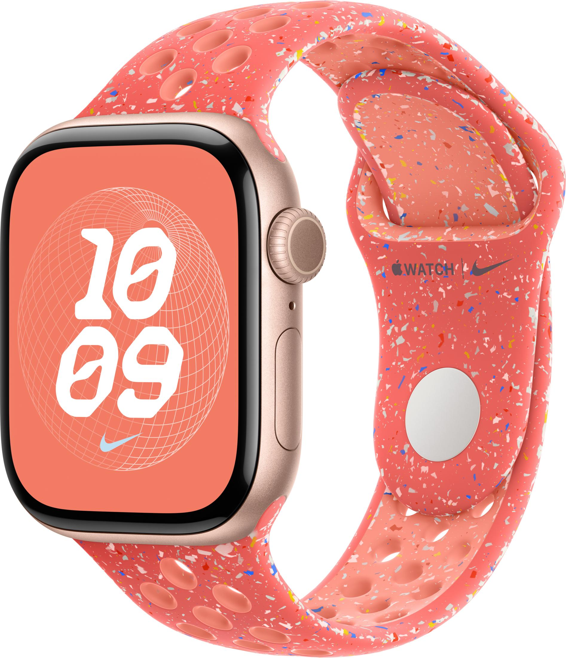 Różowy smartwatch z kolorową, cętkowaną bransoletą, pokazany z boku.