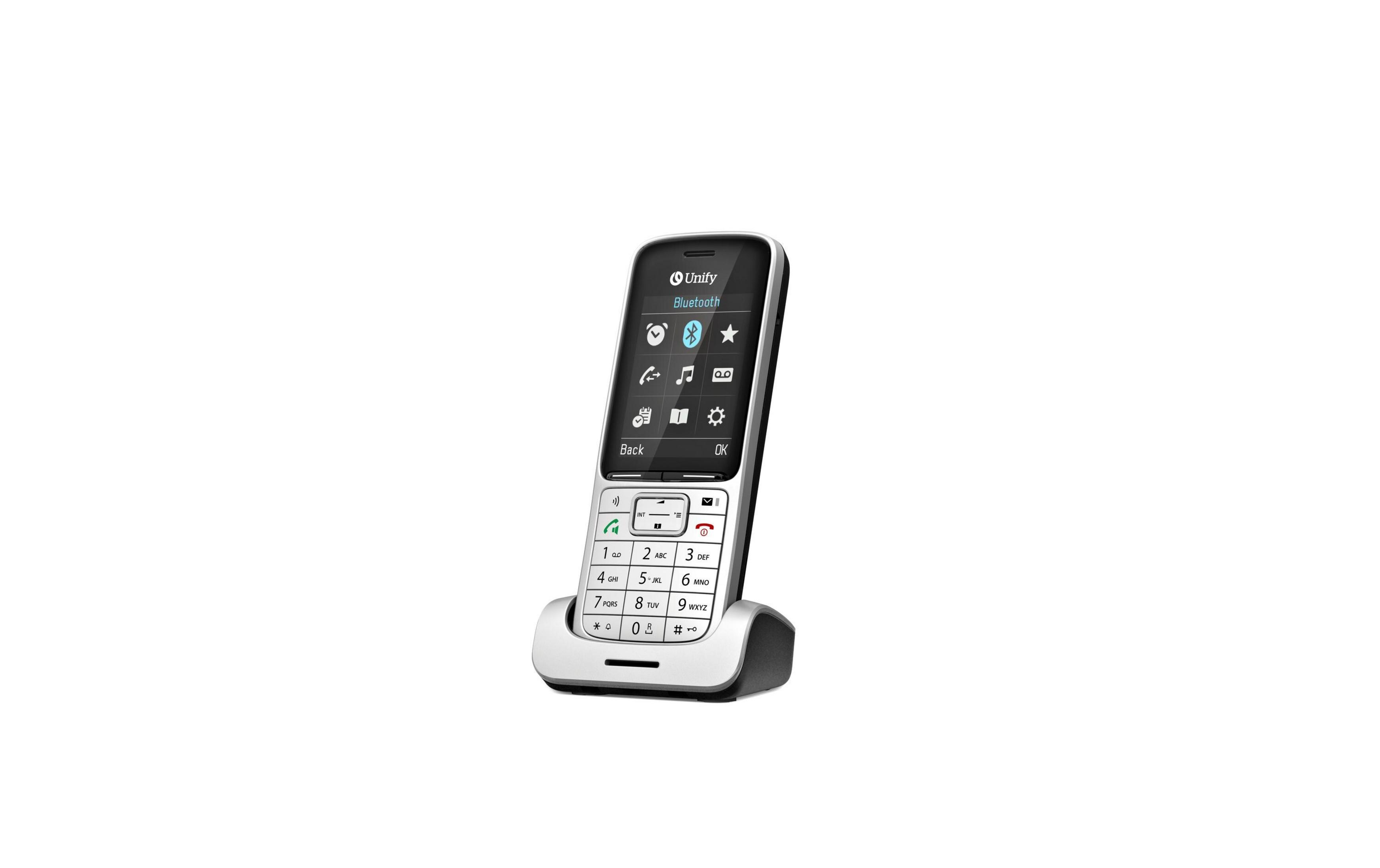 Un telefono cordless con tastiera e schermo, appoggiato sulla base di ricarica.