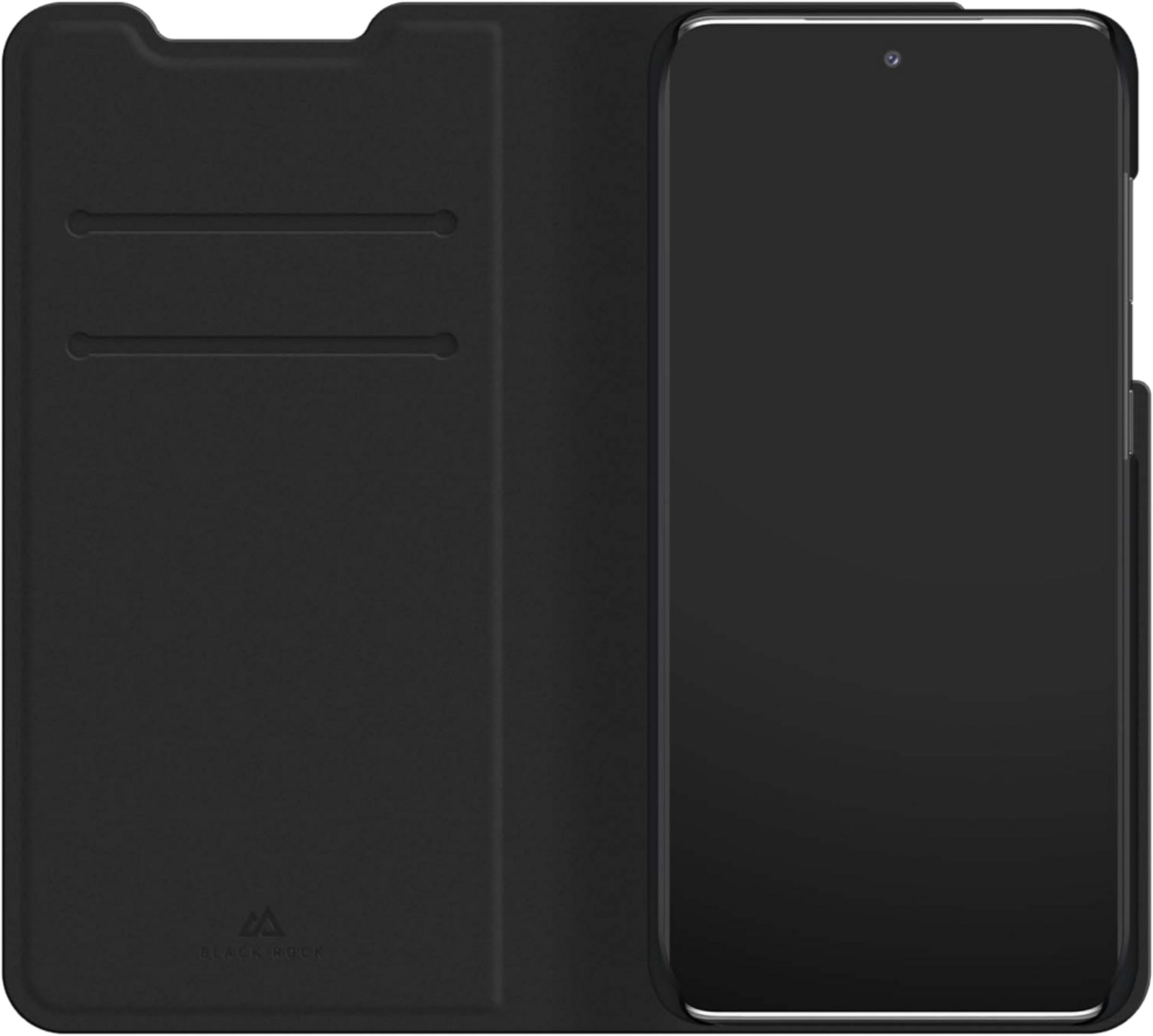 Smartphone nero in custodia protettiva aperta con slot per carte.