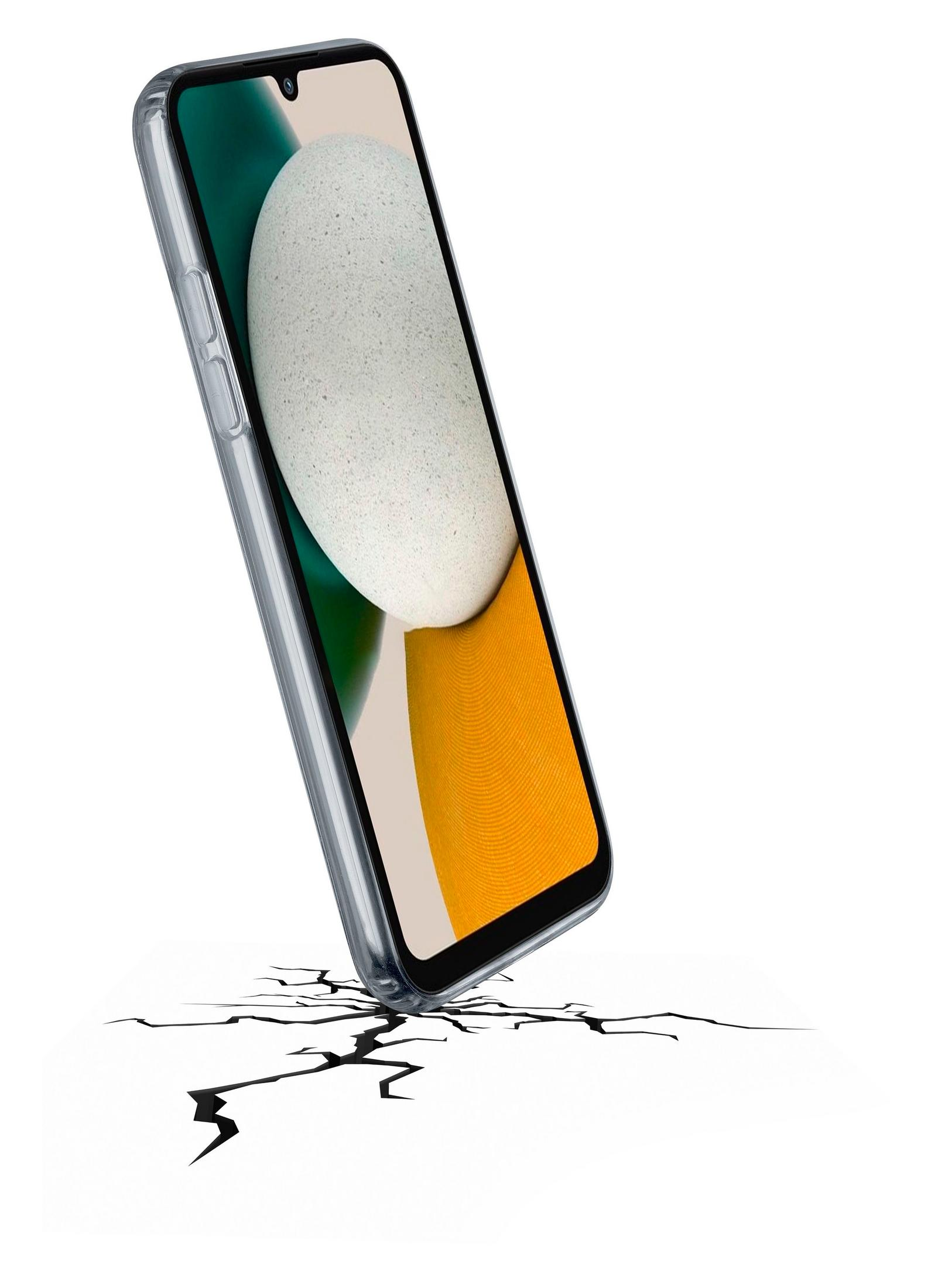Un telefono trasparente poggia su una superficie bianca incrinata.