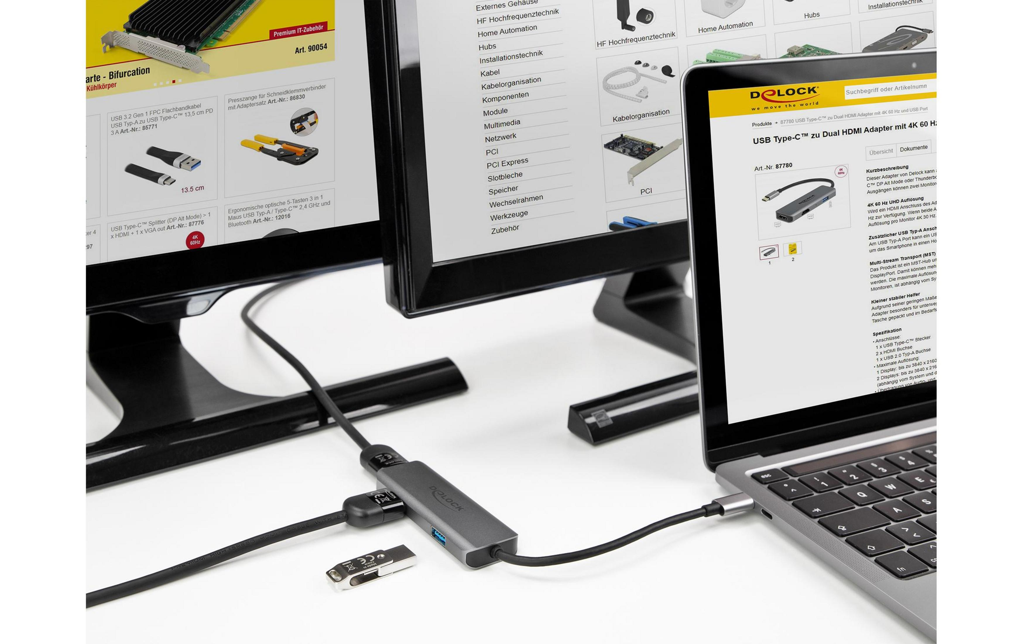 Ein Laptop ist über einen USB-C-Adapter mit einem Monitor verbunden.