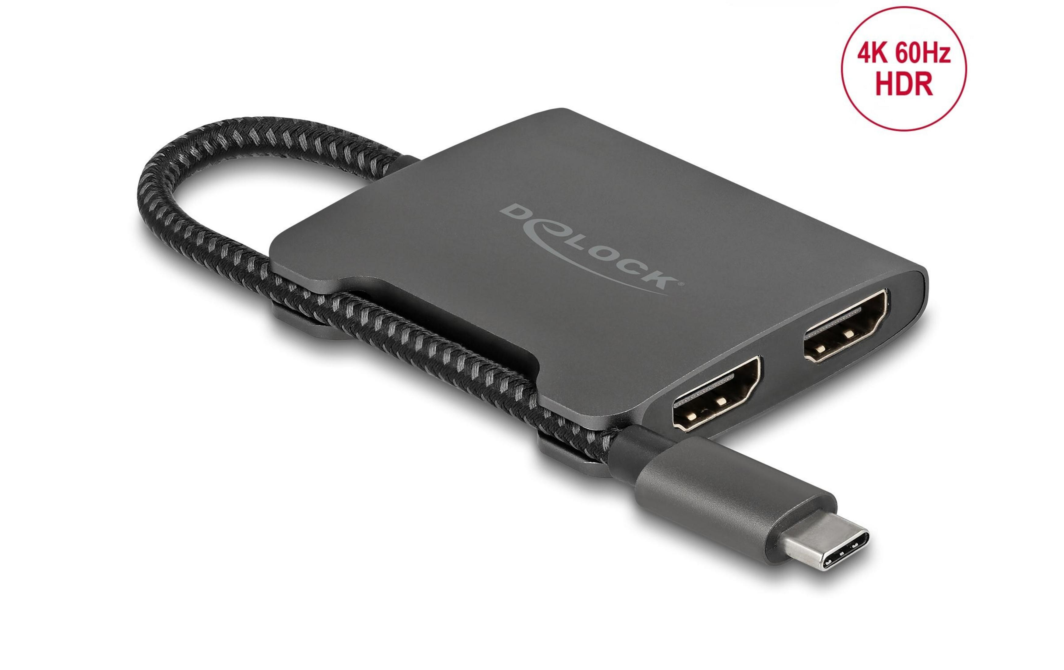 Grauer Delock USB-C-Adapter mit zwei HDMI-Anschlüssen und einem Kabel.