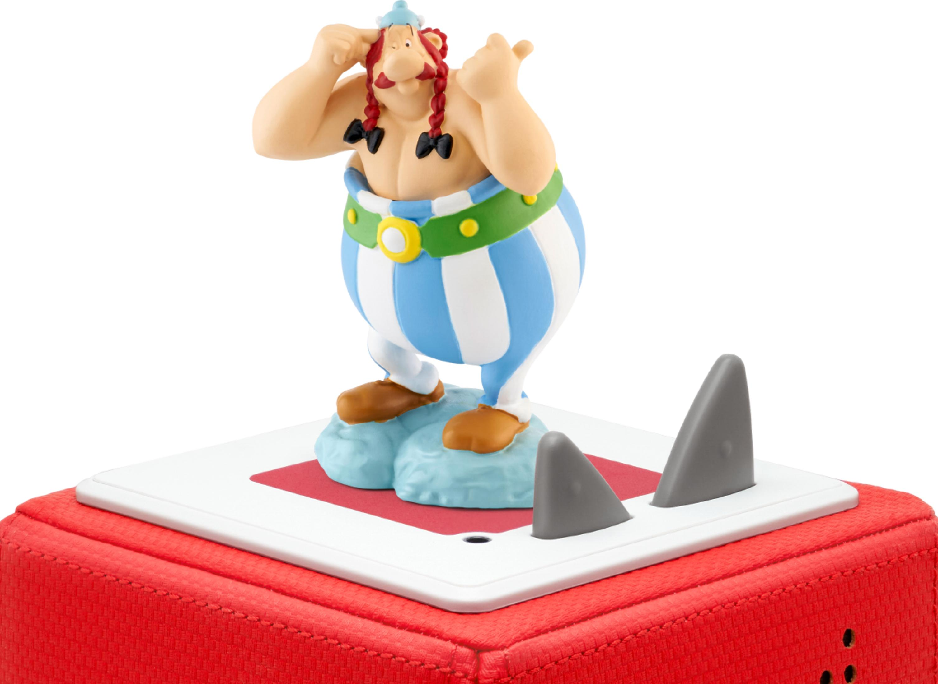 Asterix-Figur auf einer roten Box mit Haifischflossen.