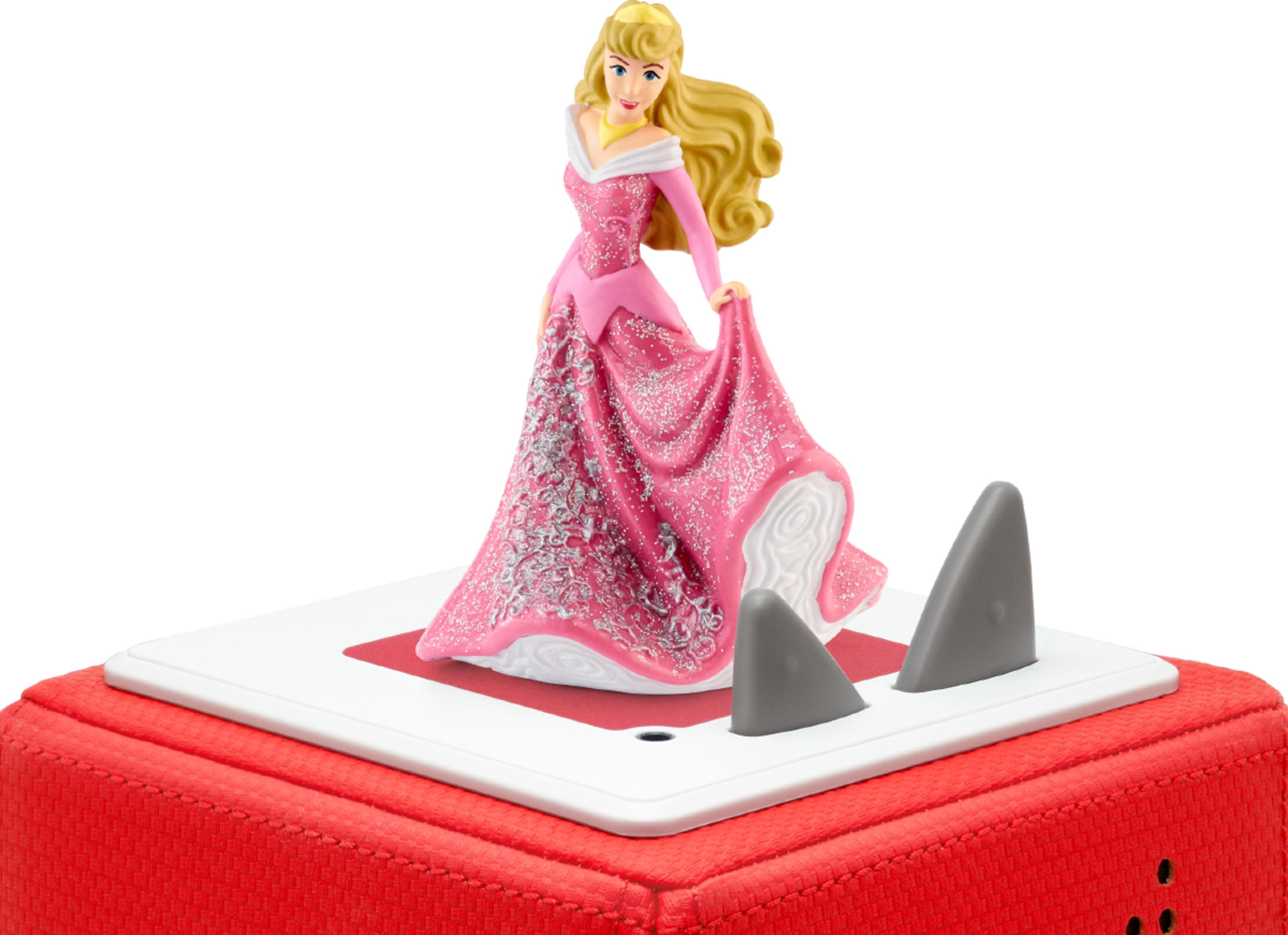 Aurora-Figur in rosa Kleid auf rotem Kasten mit grauen Flossen.
