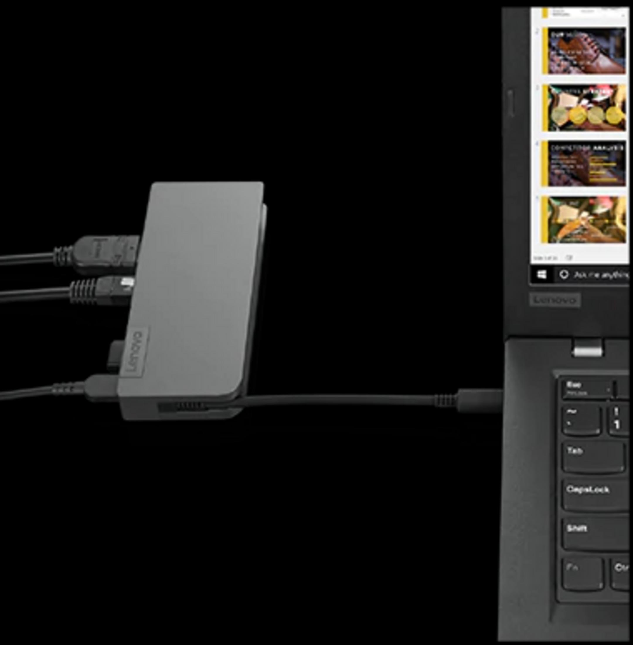 Un dock Lenovo grigio con cavi collegati, inserito in un laptop.