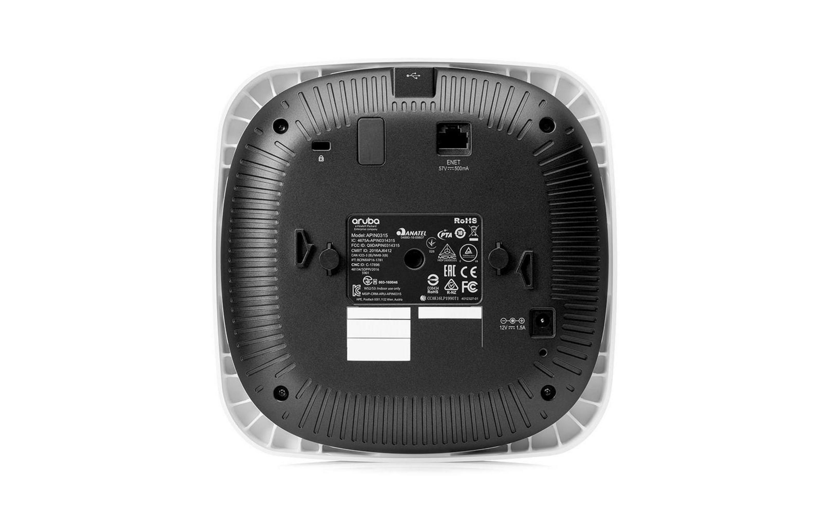 Spód białego punktu dostępowego Aruba z portami i etykietami certyfikacji.
