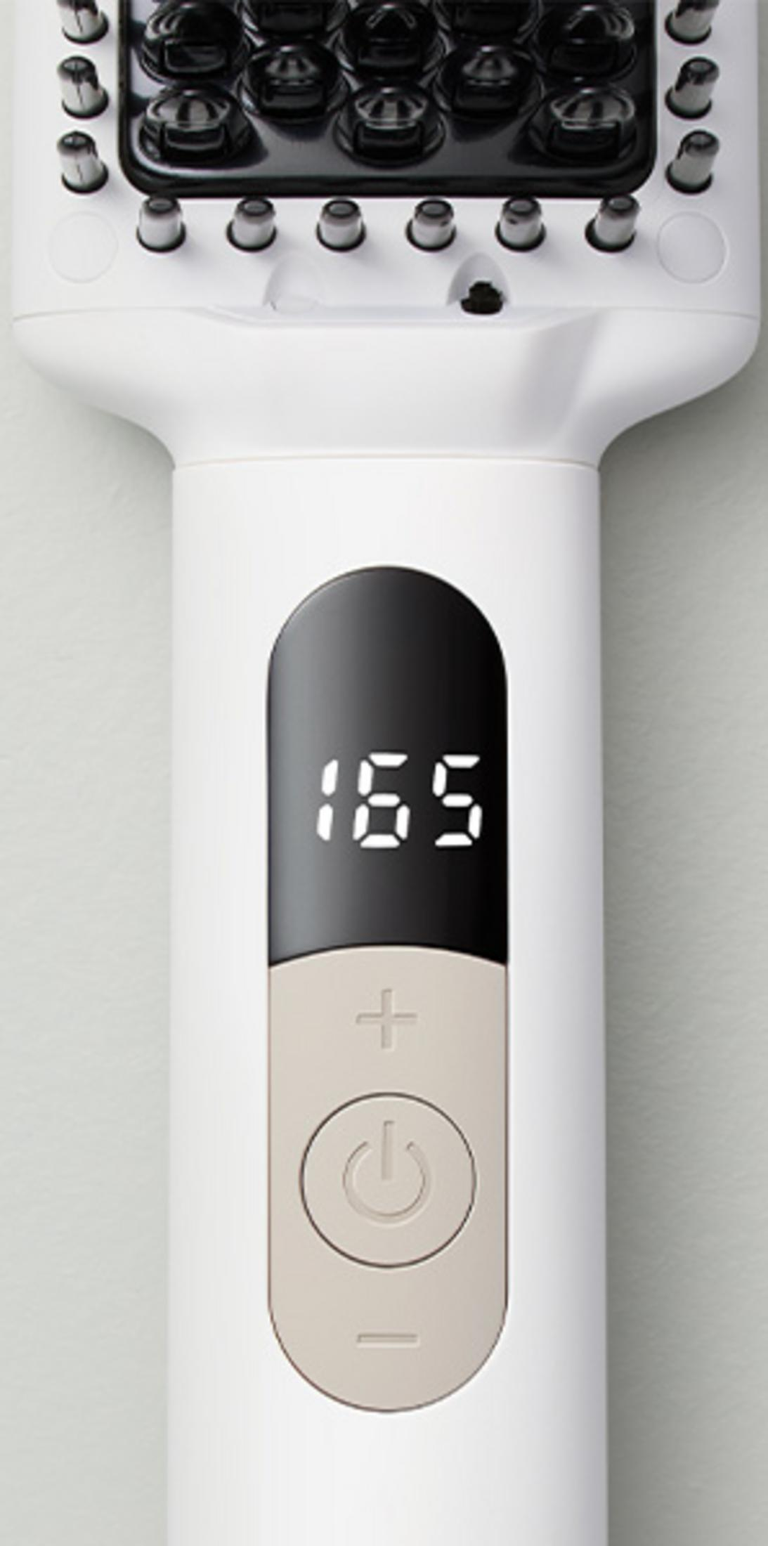 Un styler per capelli bianco con testa nera che mostra 165 gradi.