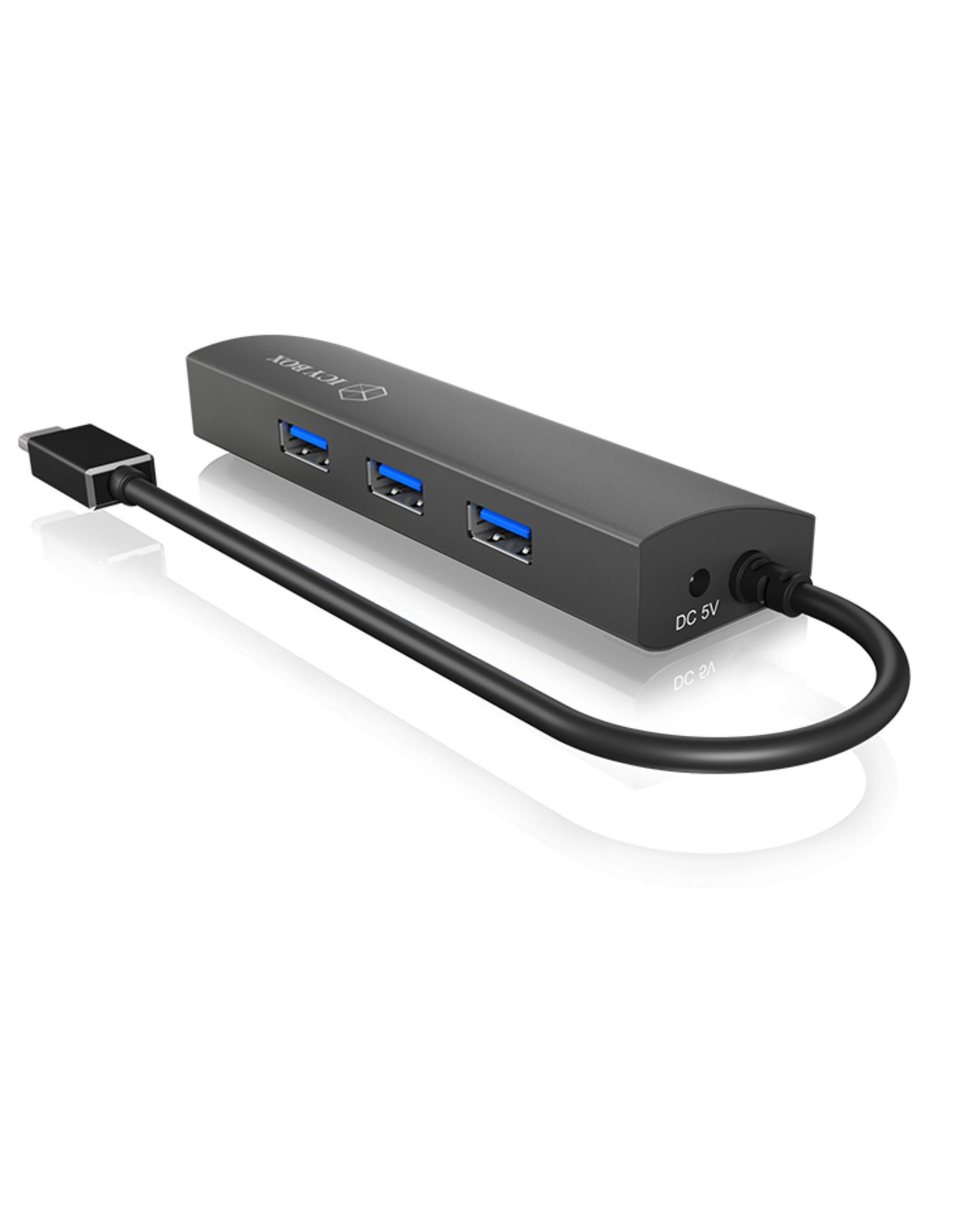 Hub USB grigio a quattro porte con cavo nero.