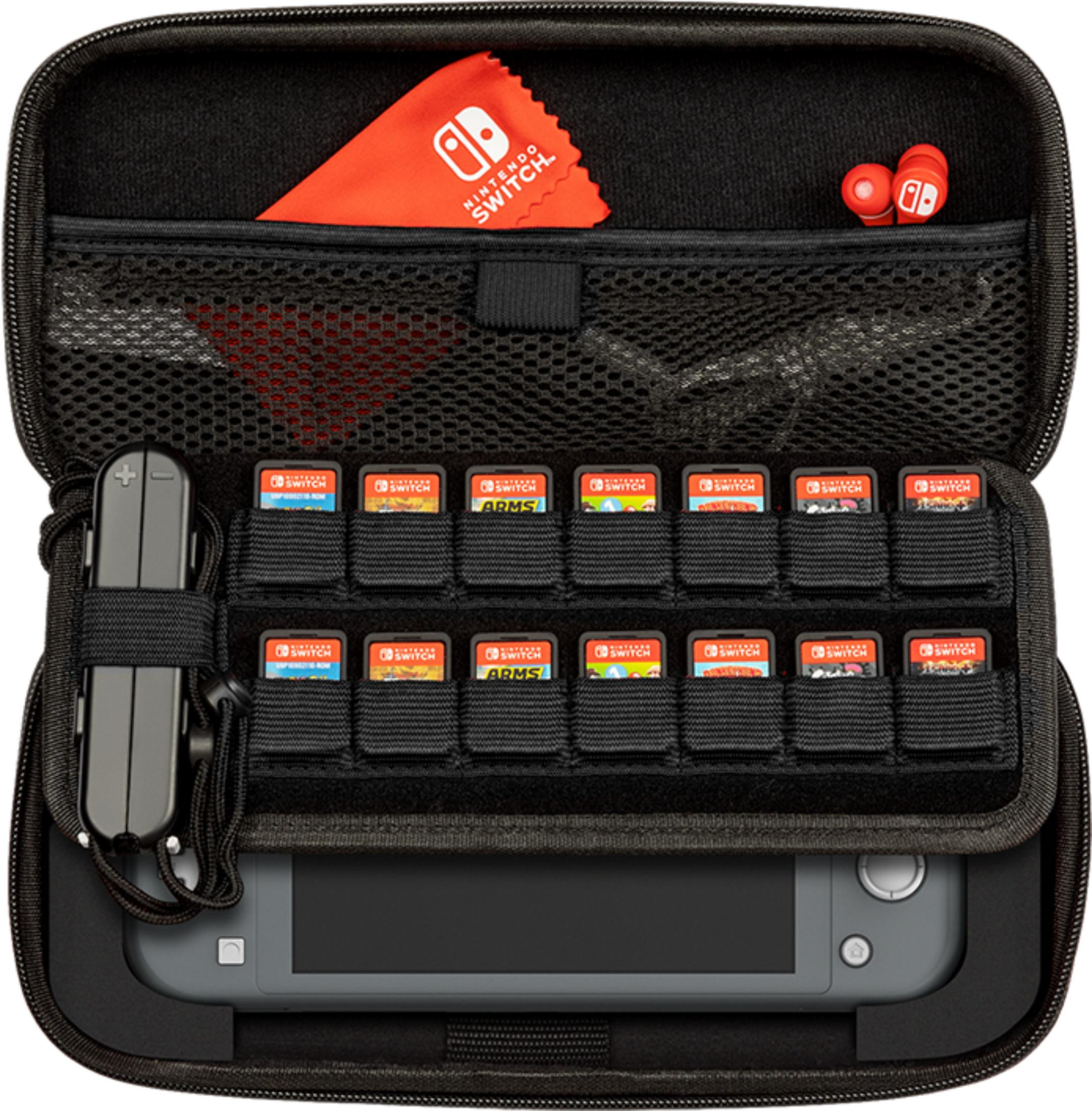 Etui Nintendo Switch z grami, konsolą, akcesorium ładowania i ściereczką.