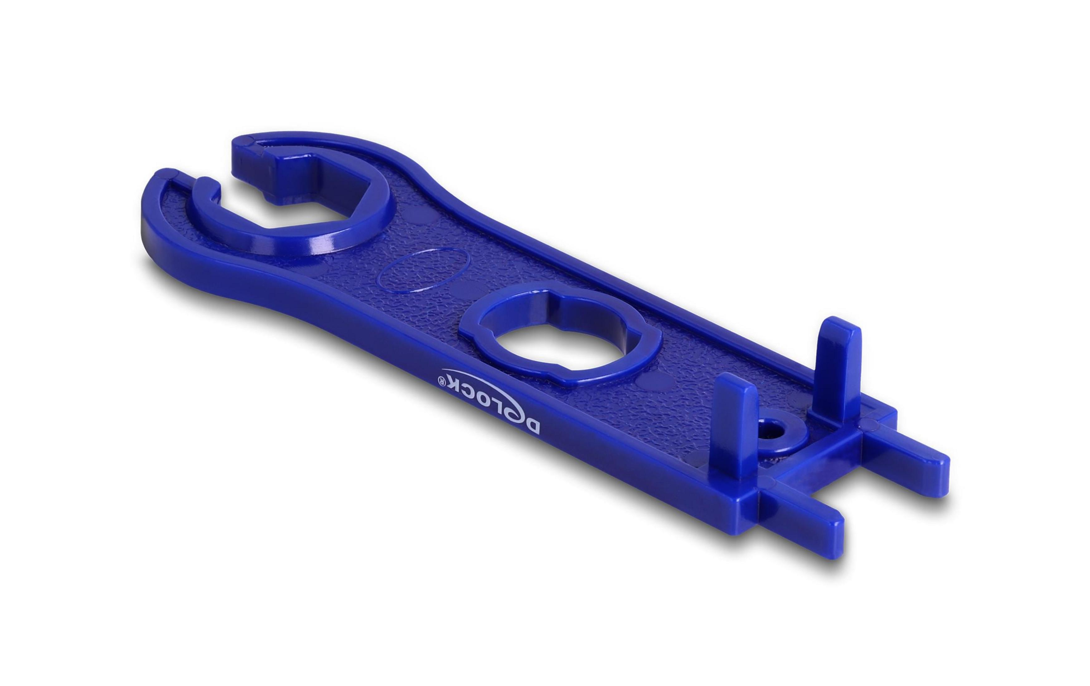 Un attrezzo in plastica blu con varie fessure e perni per il montaggio.