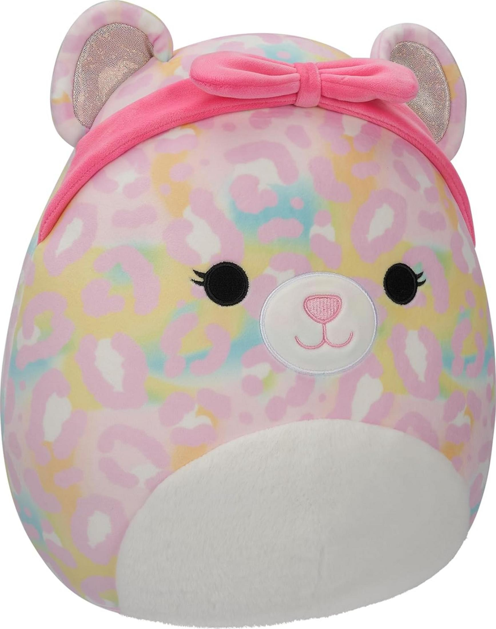 Ein bunter Plüschbär mit rosa Schleife und Leopardenmuster.