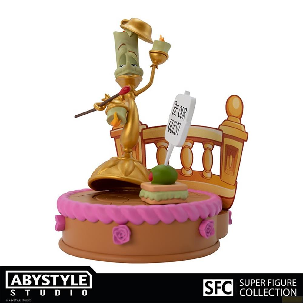 Figura de Lumière sobre un pastel con cartel "Be Our Guest".