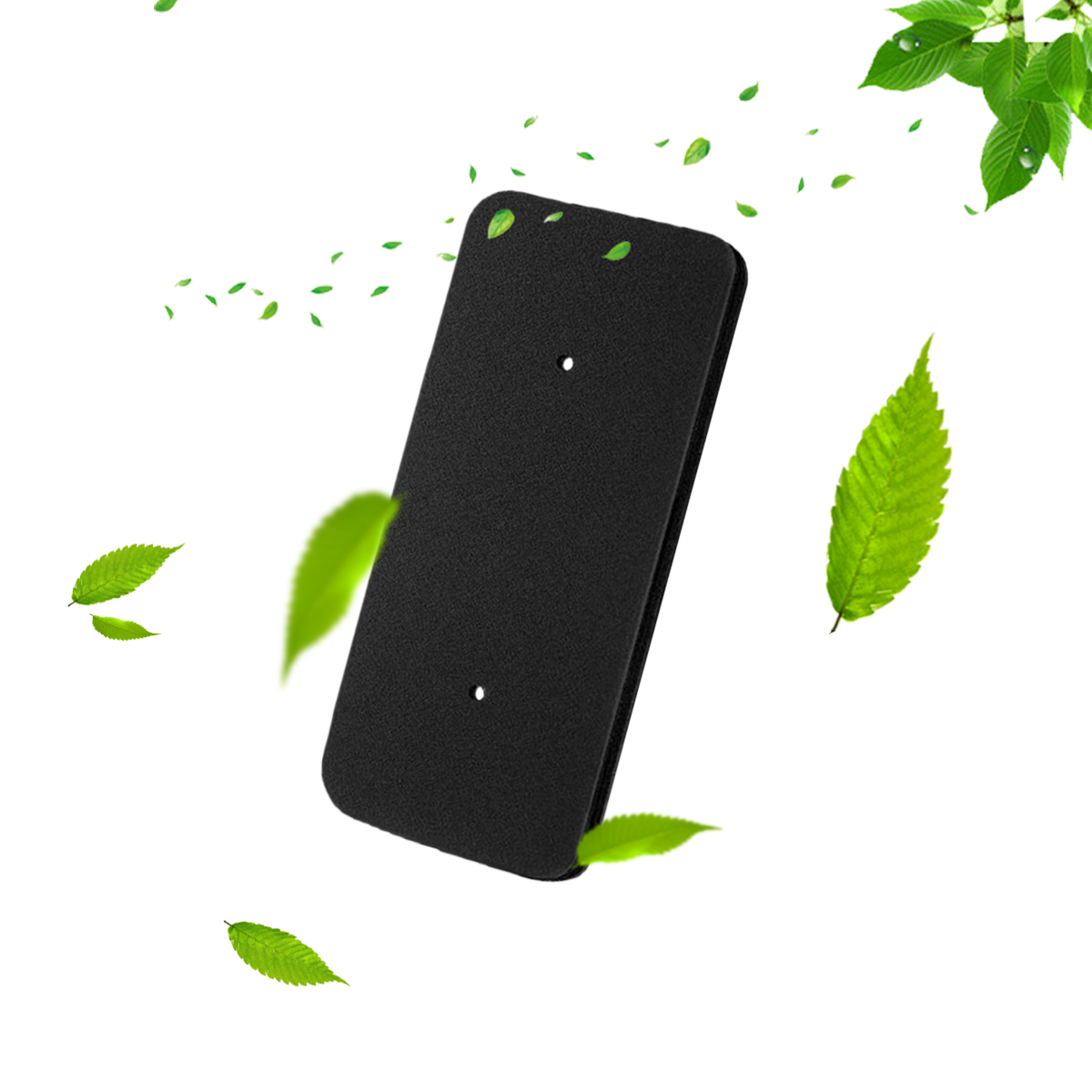 Czarny prostokąt unosi się wśród zielonych liści na białym tle.