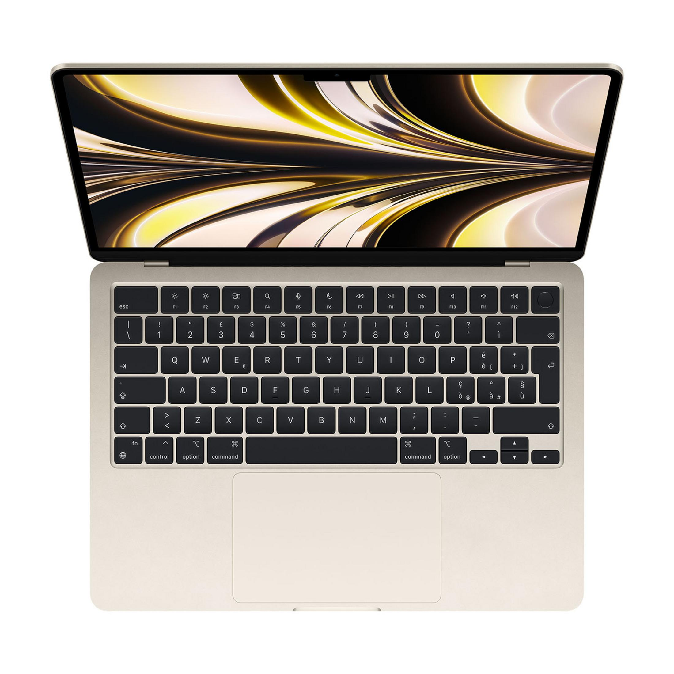 Un laptop dorato con lo schermo aperto, che mostra un motivo astratto.