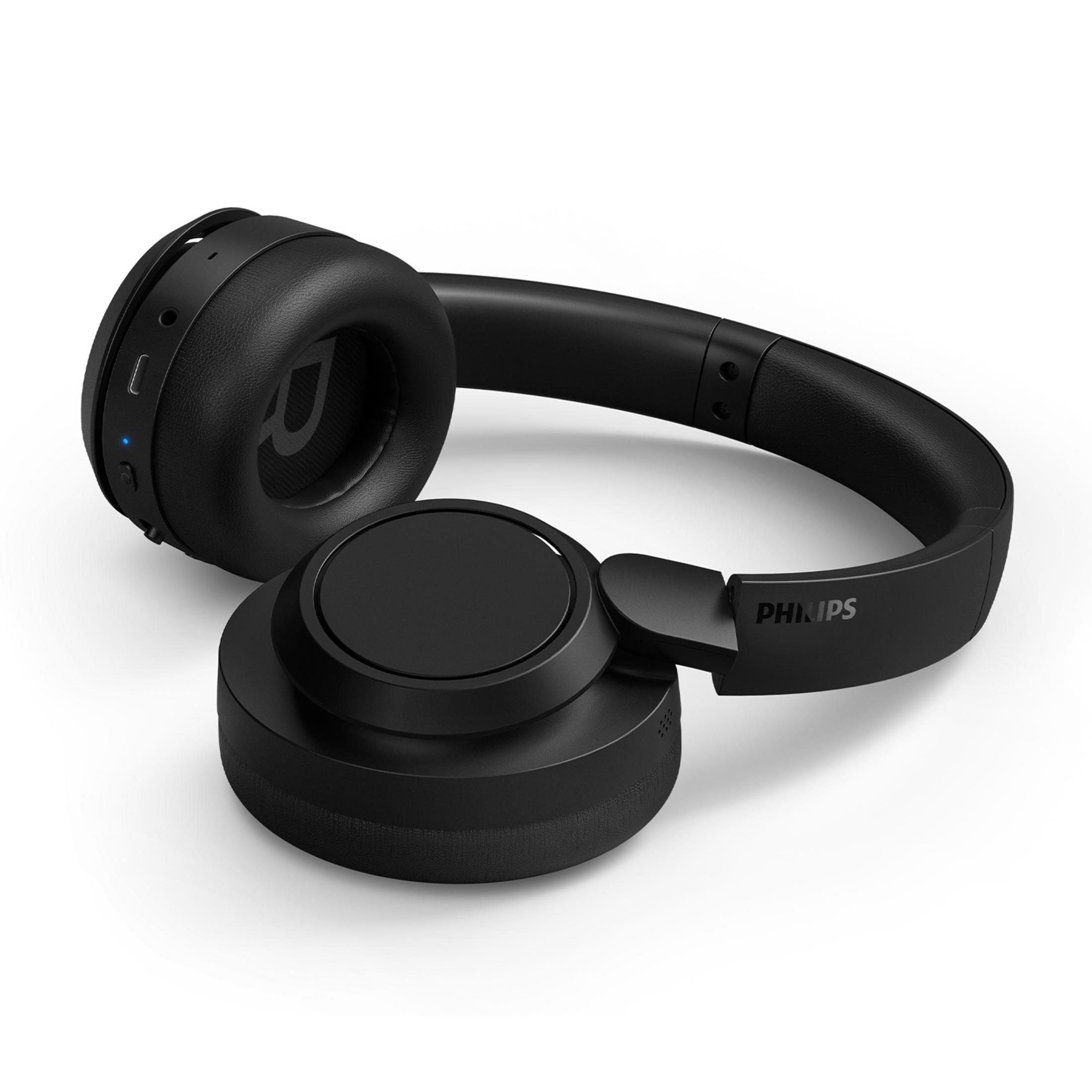 Auriculares Philips negros con diadema y almohadillas sobre fondo blanco.