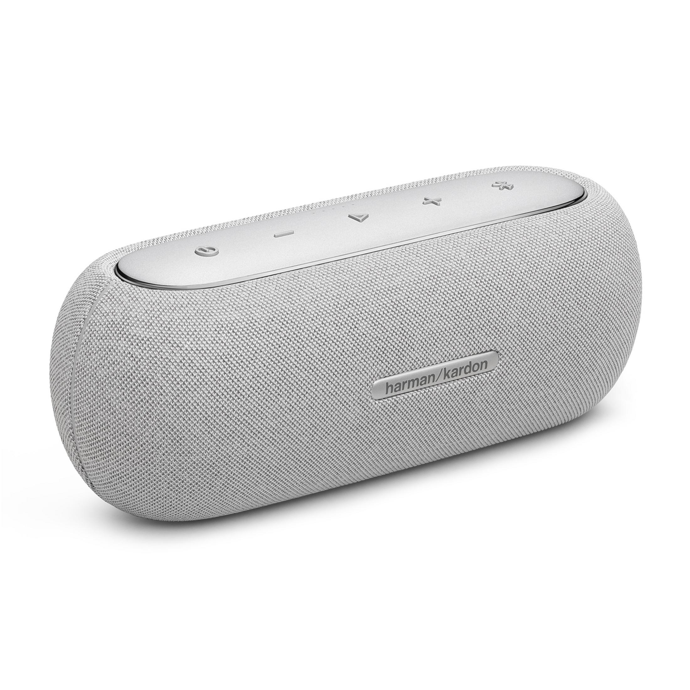 Un altavoz Bluetooth Harman Kardon gris con controles plateados en la parte superior.