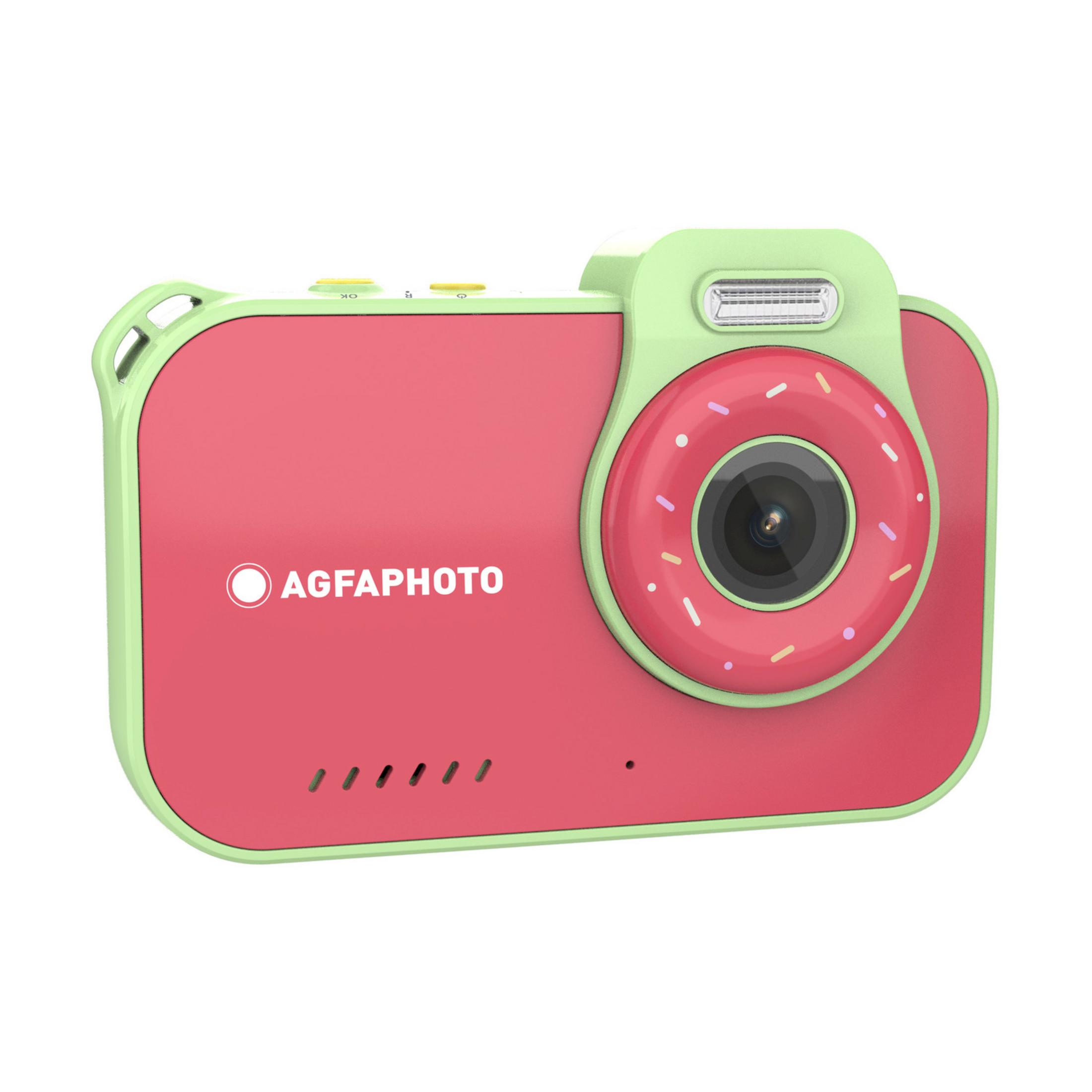 Eine pinke Digitalkamera mit hellgrünen Akzenten und einem Donut-Design um das Objektiv.