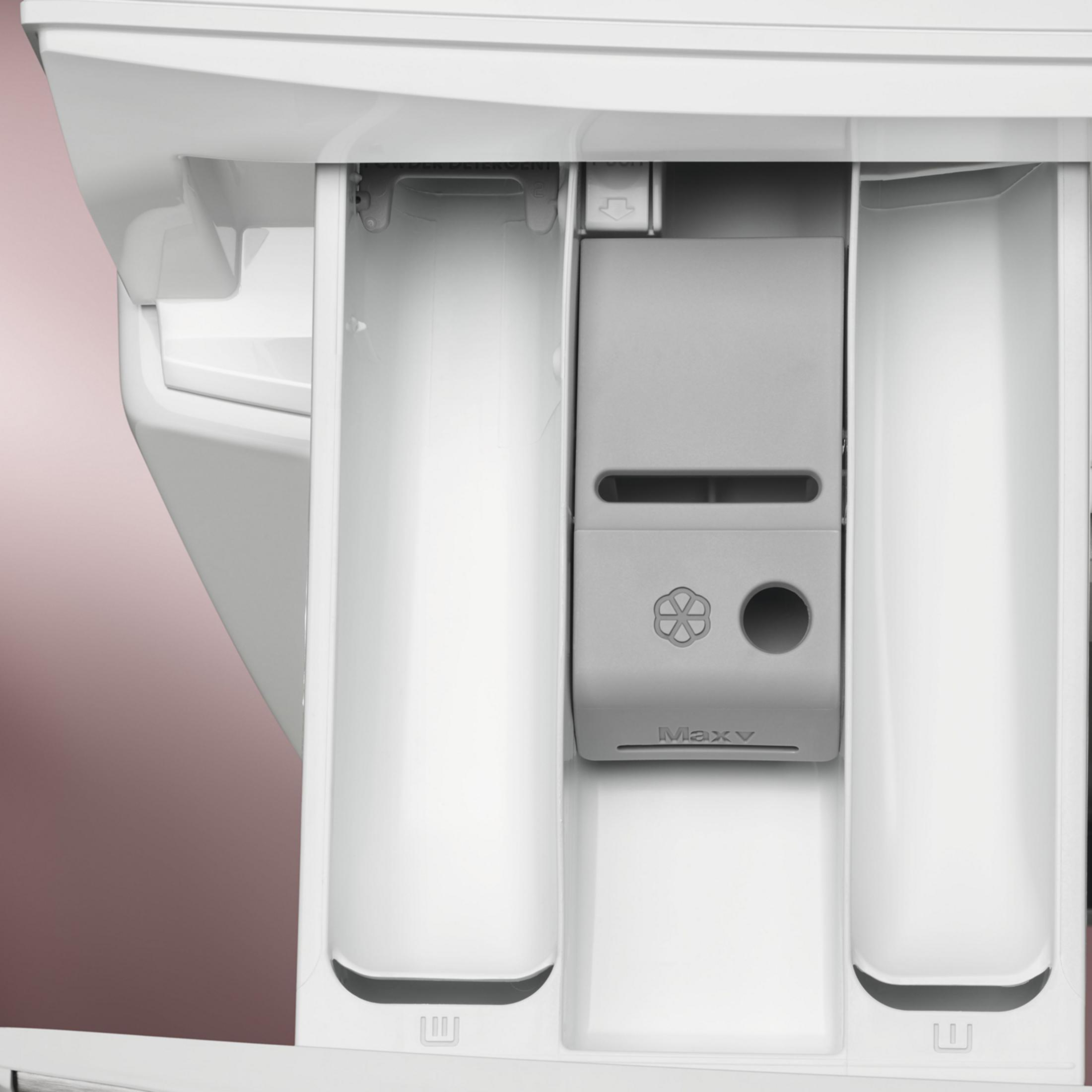 Zbliżenie szuflady na detergent pralki z przegródkami.