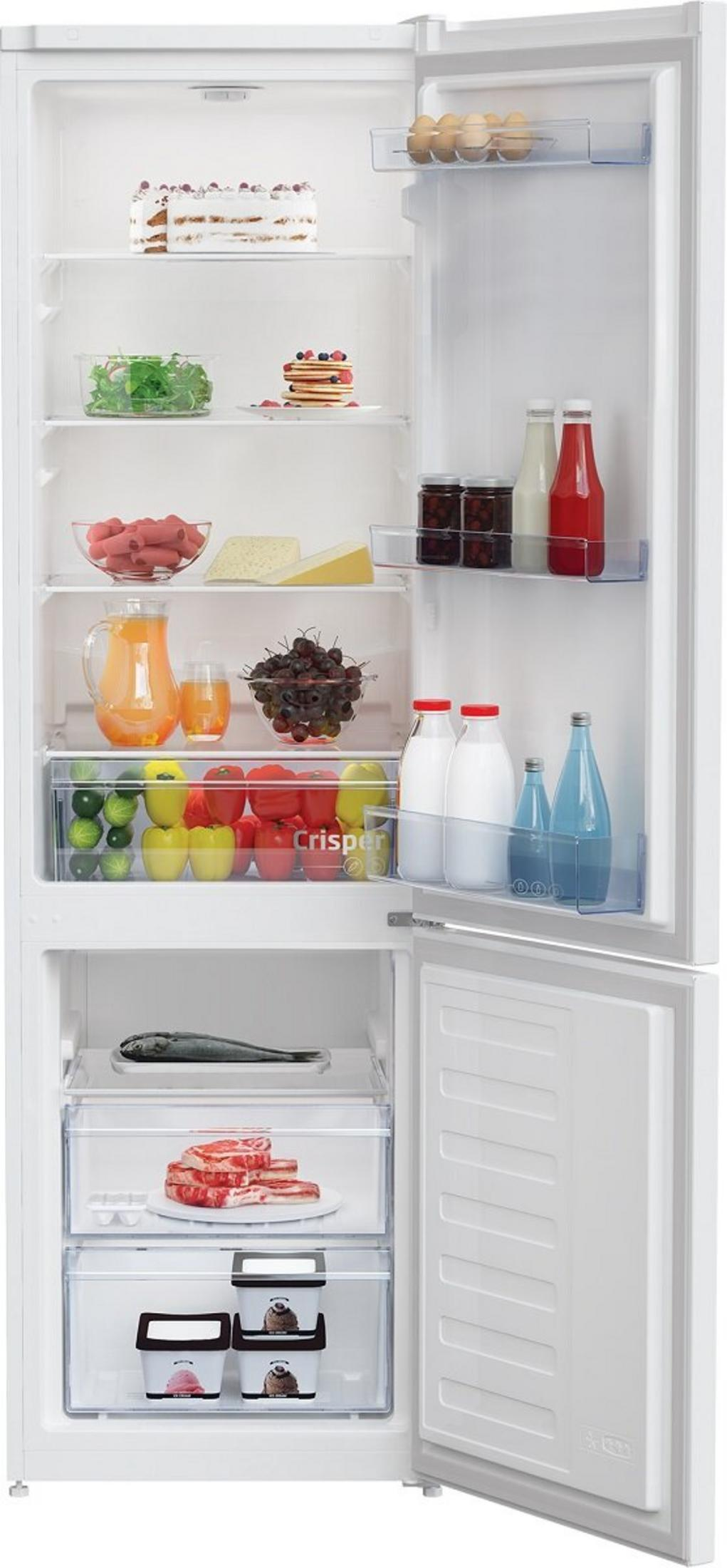 Ein offener Kühlschrank mit Lebensmitteln: Kuchen, Pfannkuchen, Obst, Gemüse, Fleisch, Fisch und Eis.