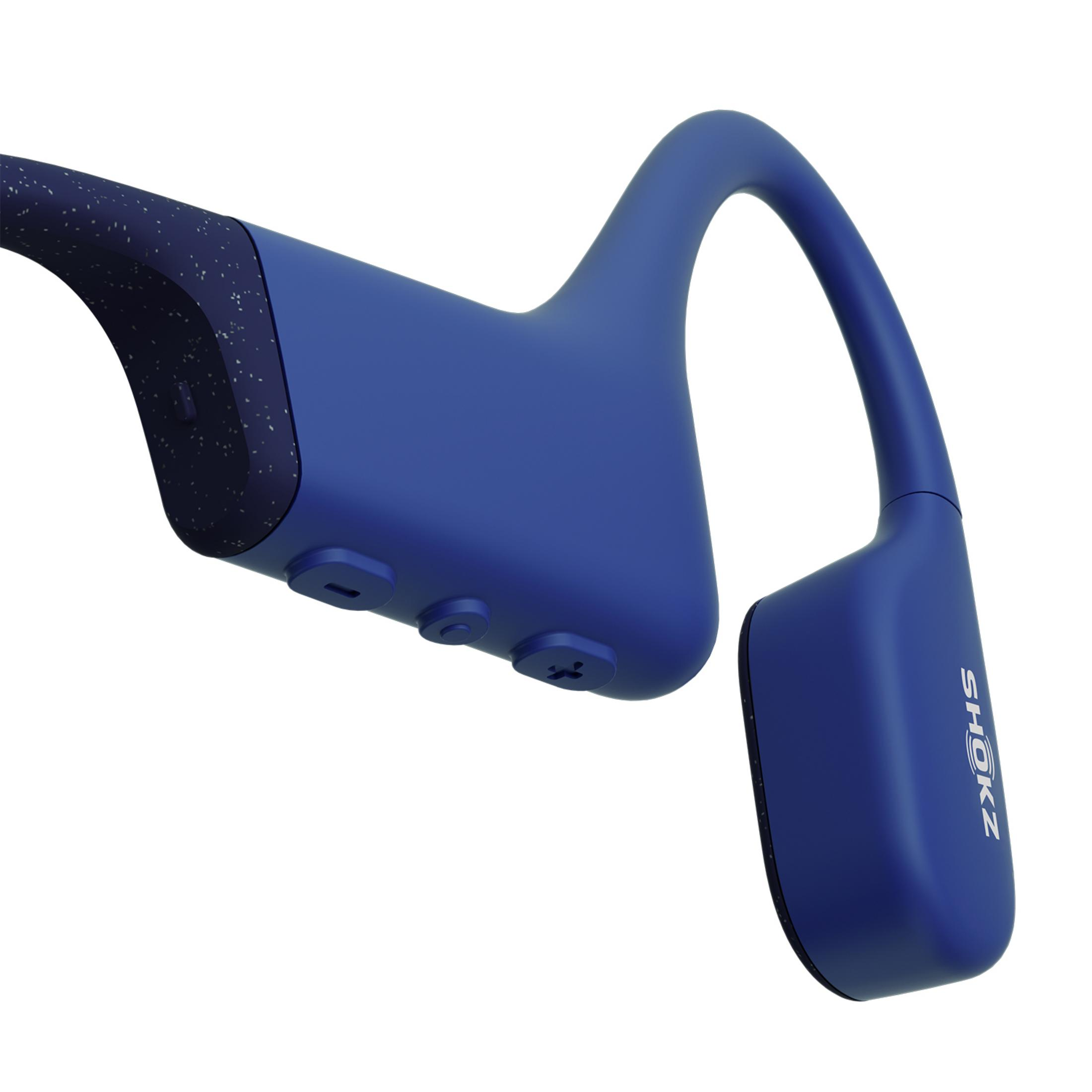 Niebieskie słuchawki z zaczepami na uszy, z białymi plamkami po jednej stronie.