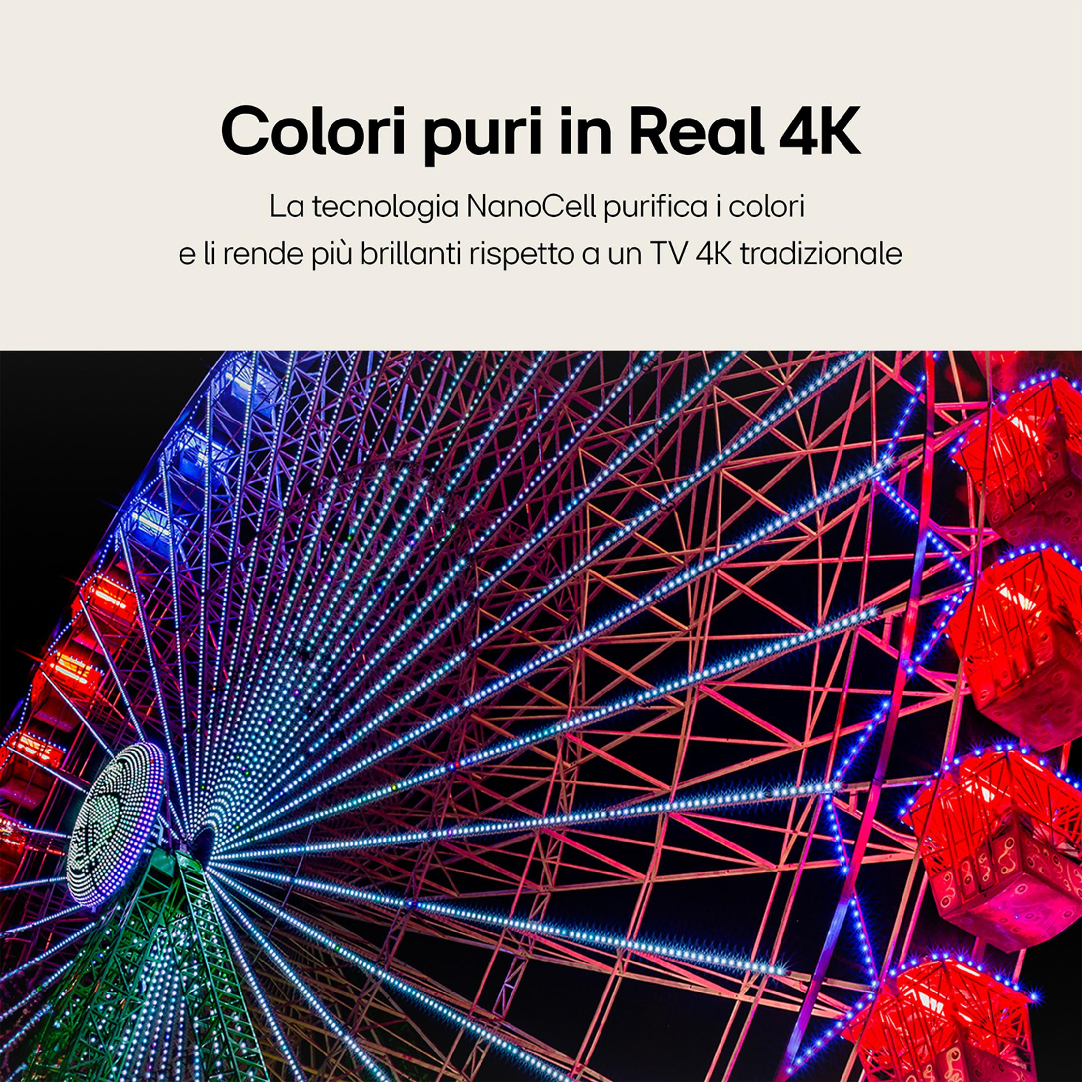 Jasno oświetlone koło widokowe z czerwonymi i niebieskimi światłami w nocy.