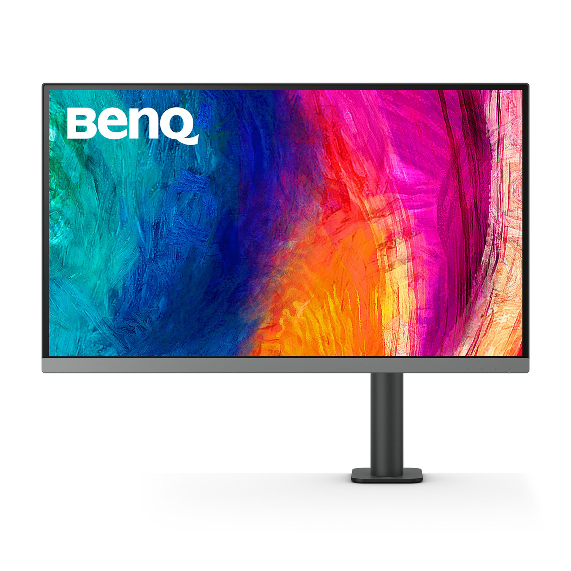 Monitor BenQ z kolorowym abstrakcyjnym tłem na ciemnej podstawie.