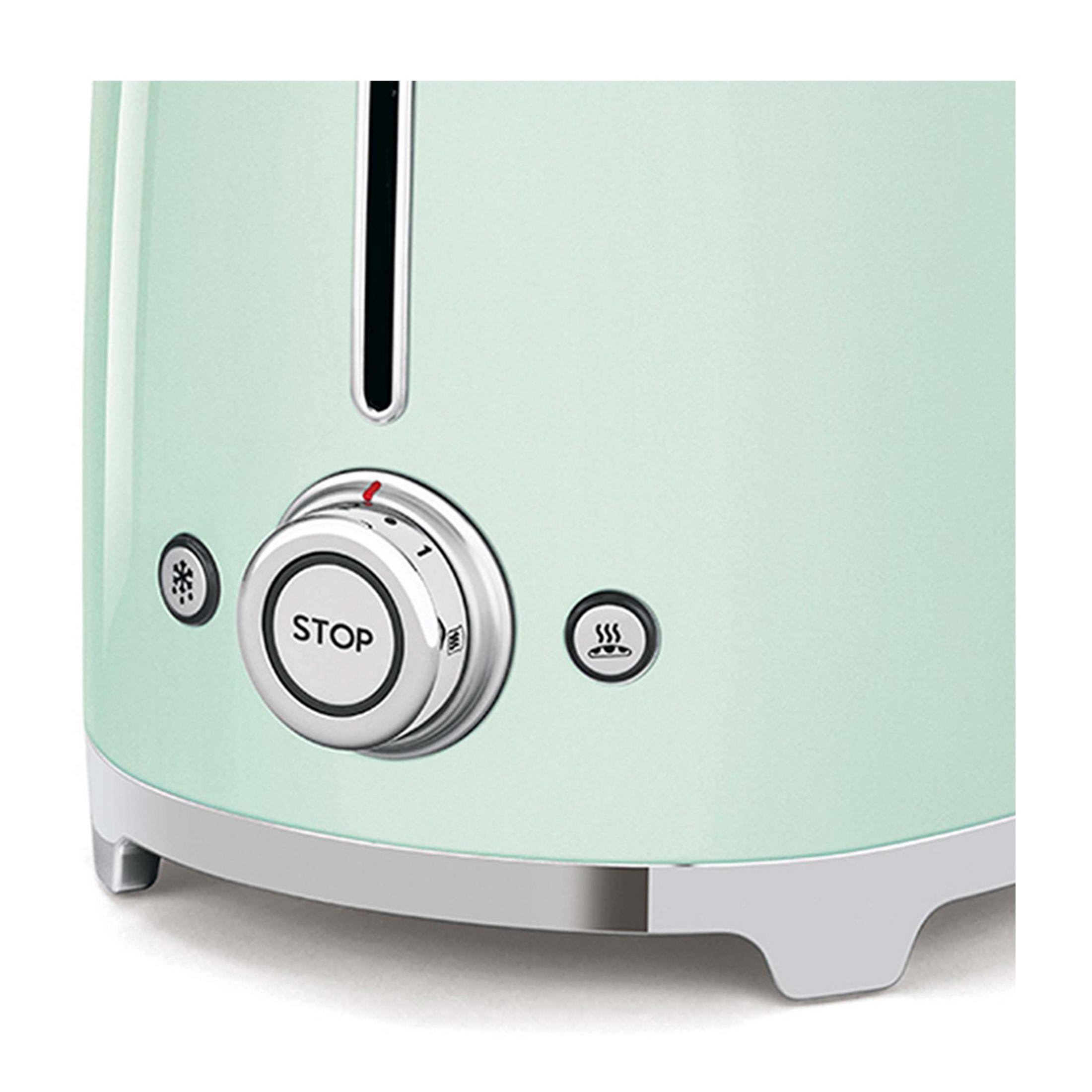 Miętowa zielona tostera ze srebrnym pokrętłem i przyciskami.